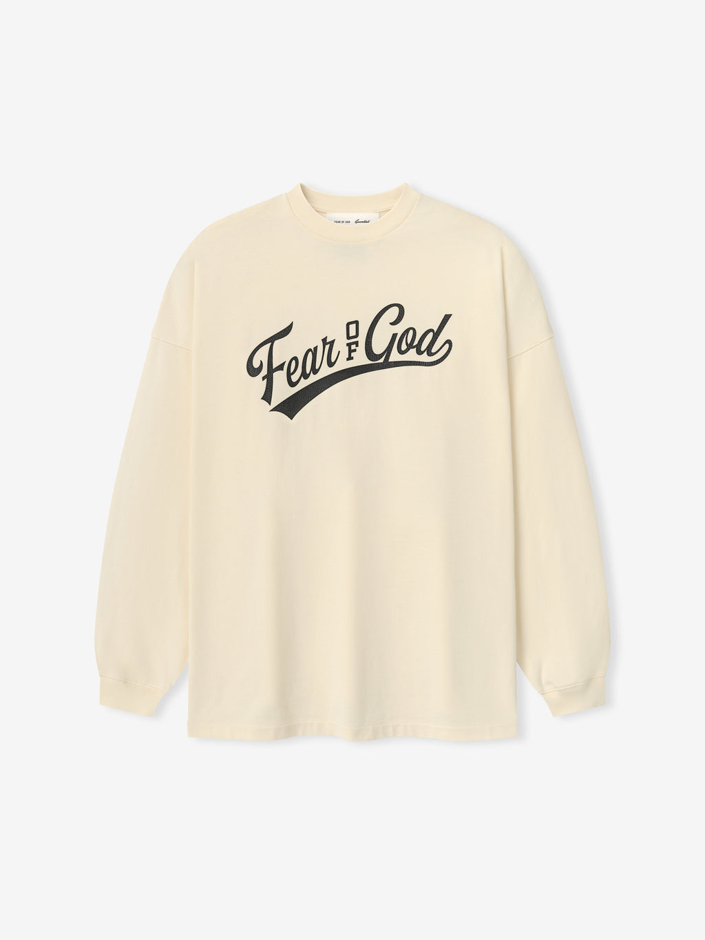 Merch Long Sleeve Tee in a soft chalk color featuring a classic crew neckline and long sleeves, with a bold black "Fear of God" graphic across the chest for a minimalist look.