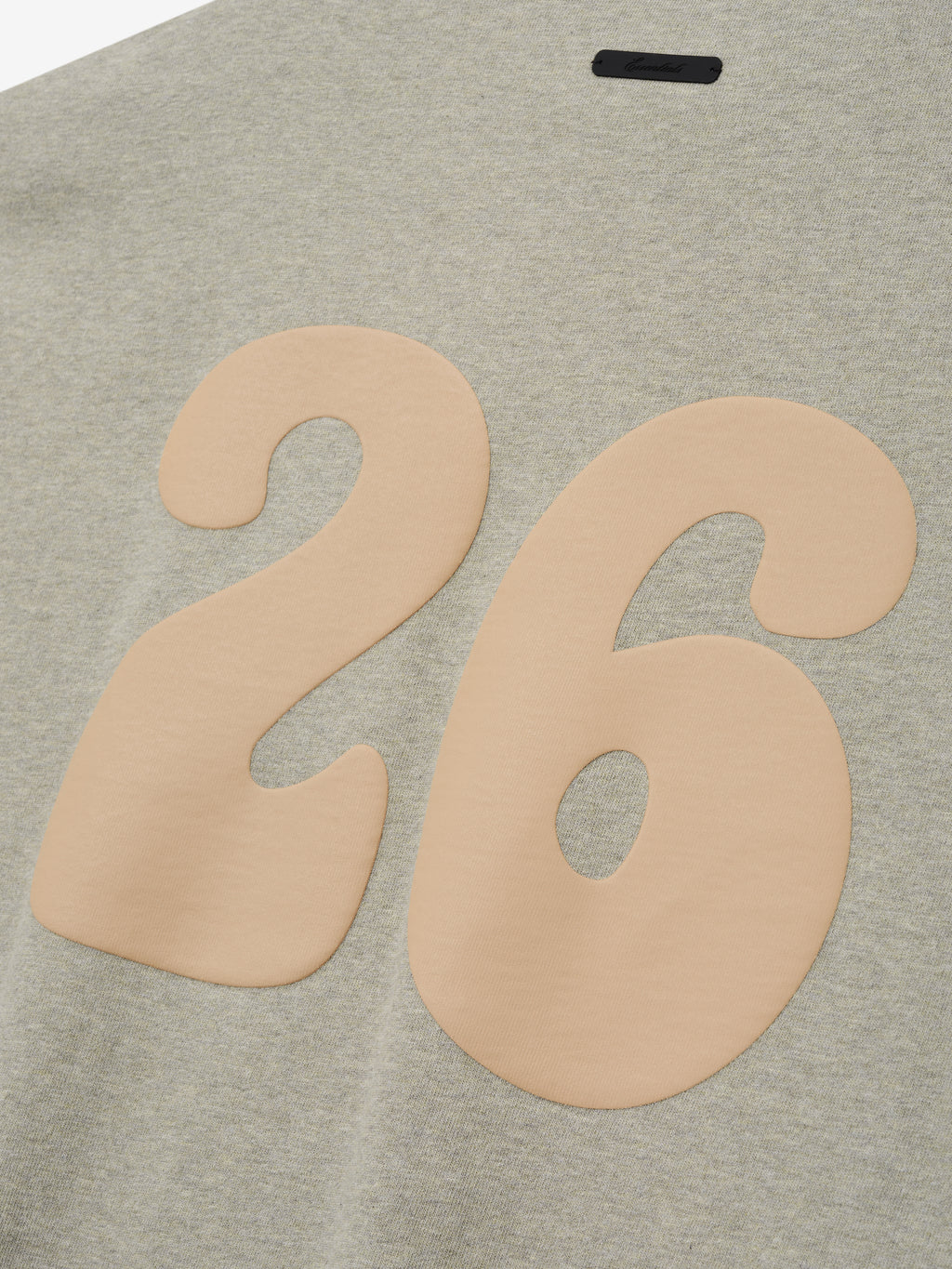 Heavy Jersey Merch Tee in a soft heathered seal tone, featuring a smooth beige number 26 printed on the back for a relaxed and stylish casual top.