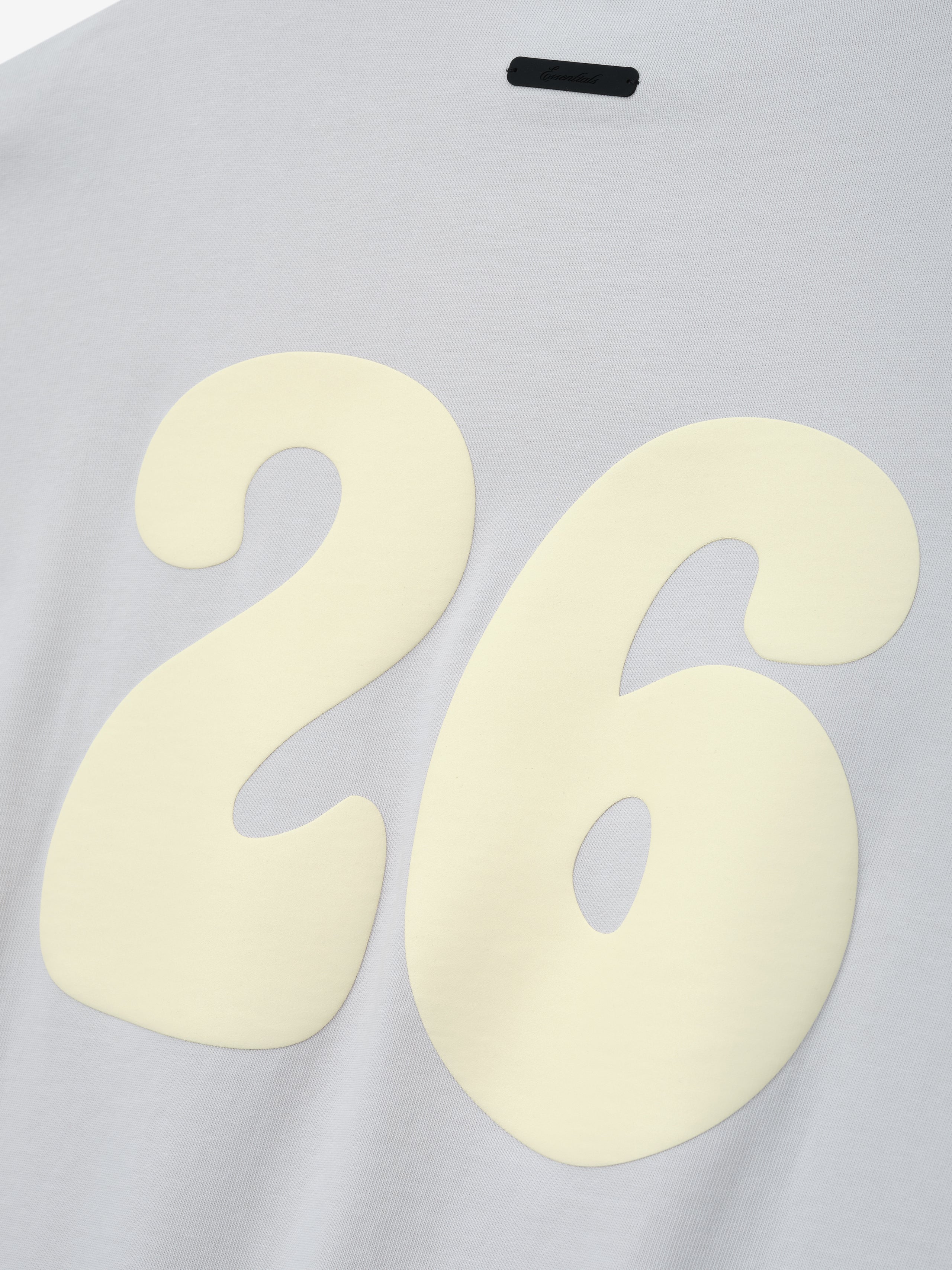 Heavy Jersey Merch Tee in a soft washed overcast shade featuring a large cream-colored number 26 printed on the back for a vintage-inspired casual top with a subtle textured finish.