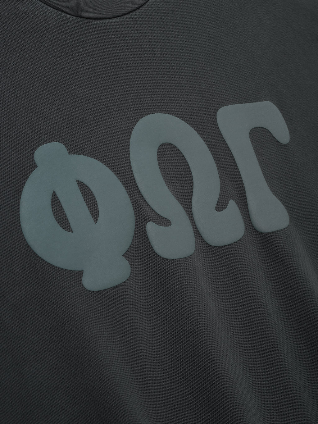 Heavy Jersey Merch Long Sleeve Tee in a washed iron grey shade featuring large matte Greek letter graphics across the chest for a minimalist, contemporary streetwear style.