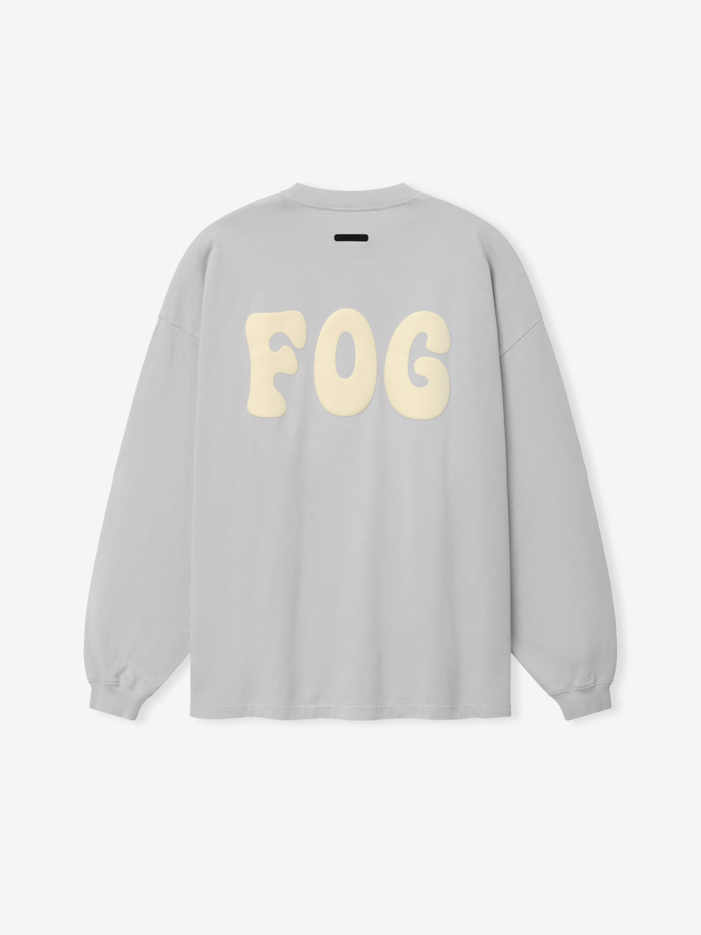 Heavy Jersey Merch Long Sleeve Tee in a light washed grey shade featuring a relaxed fit with oversized soft cream "FOG" lettering printed across the back for a clean streetwear style.