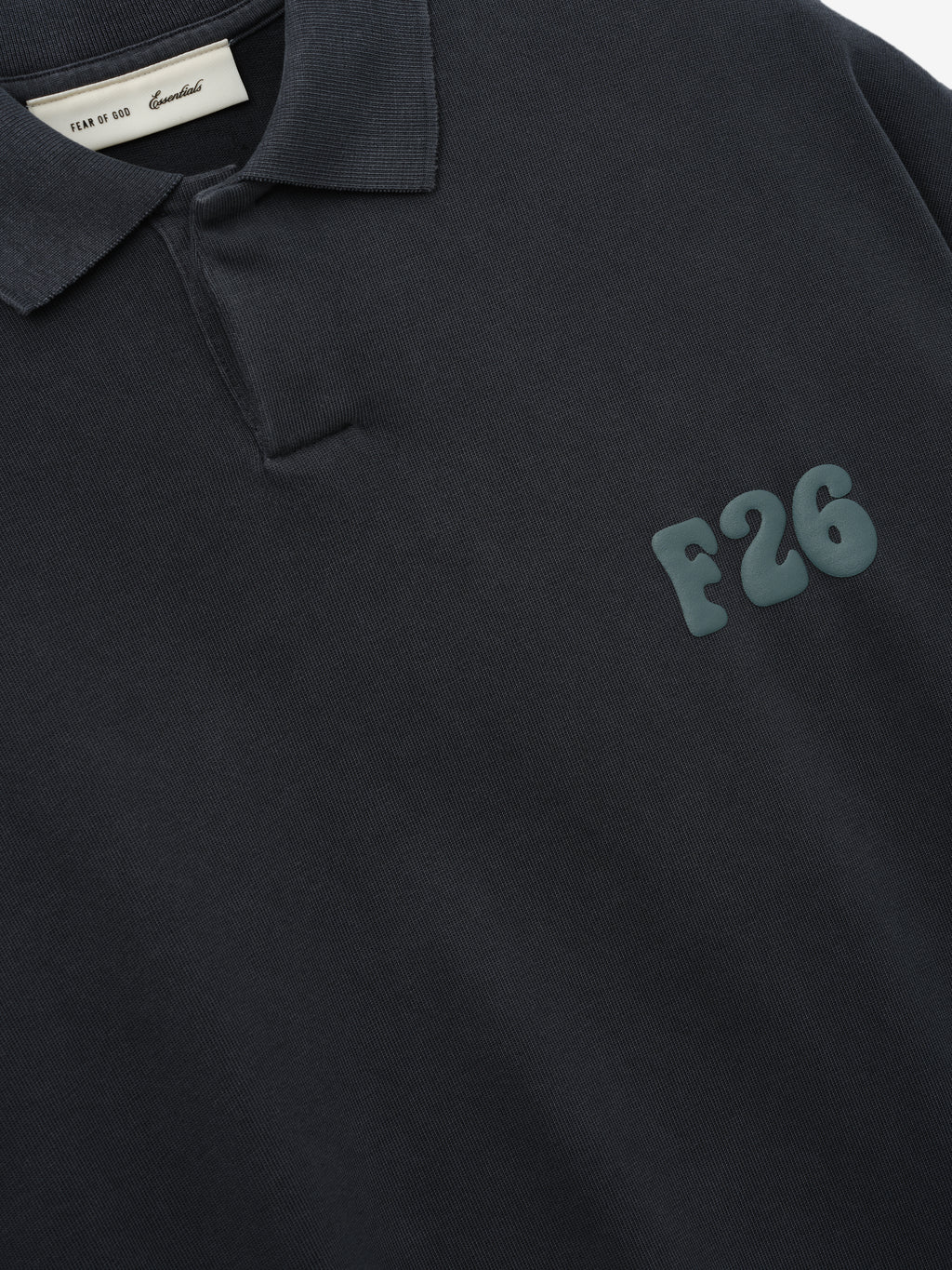 Heavy Jersey Cropped Polo in a deep washed iron grey tone, featuring a minimalist collar, short sleeves, and a raised F26 print on the chest for a modern casual top.