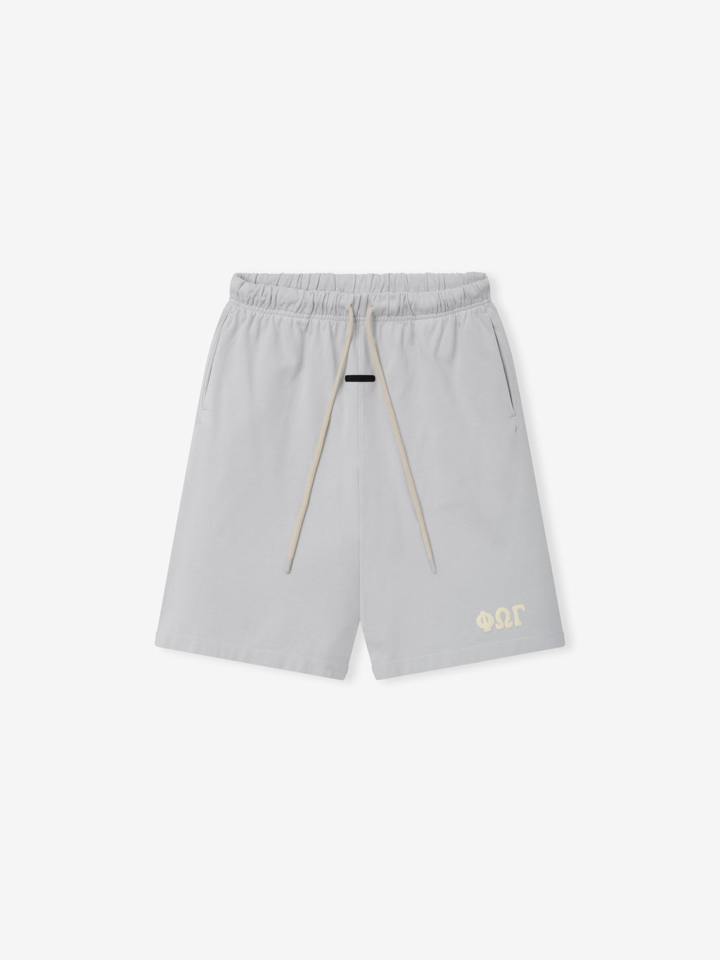 Heavy Jersey 90'S Sweatshort in a light washed iron grey with an elastic waistband, contrasting beige drawstrings, side pockets, and a small tonal logo near the hem on casual bottoms.