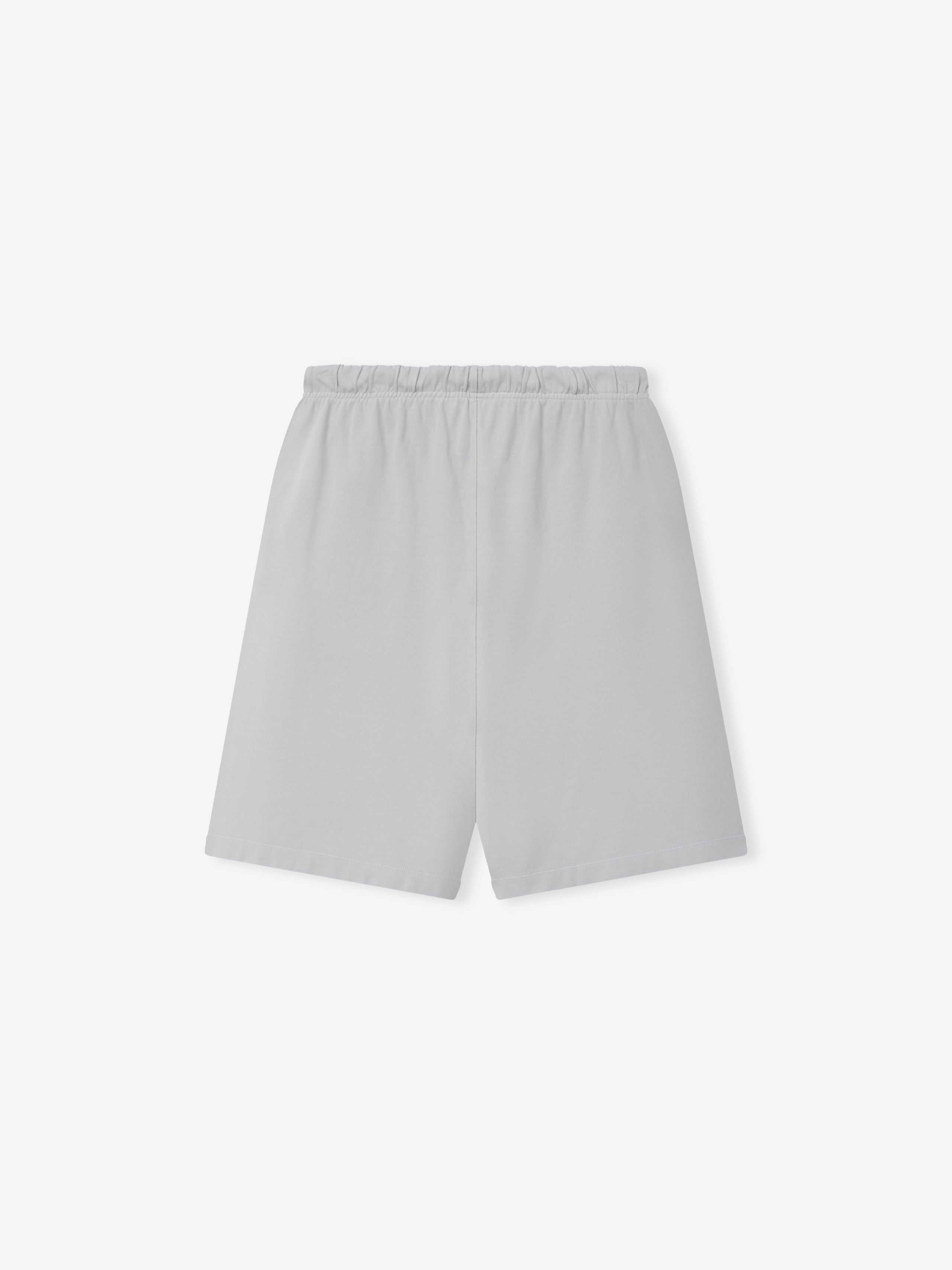 Heavy Jersey 90'S Sweatshort in a muted light grey shade, featuring an elastic waistband and a clean, minimalist back design on casual bottoms.