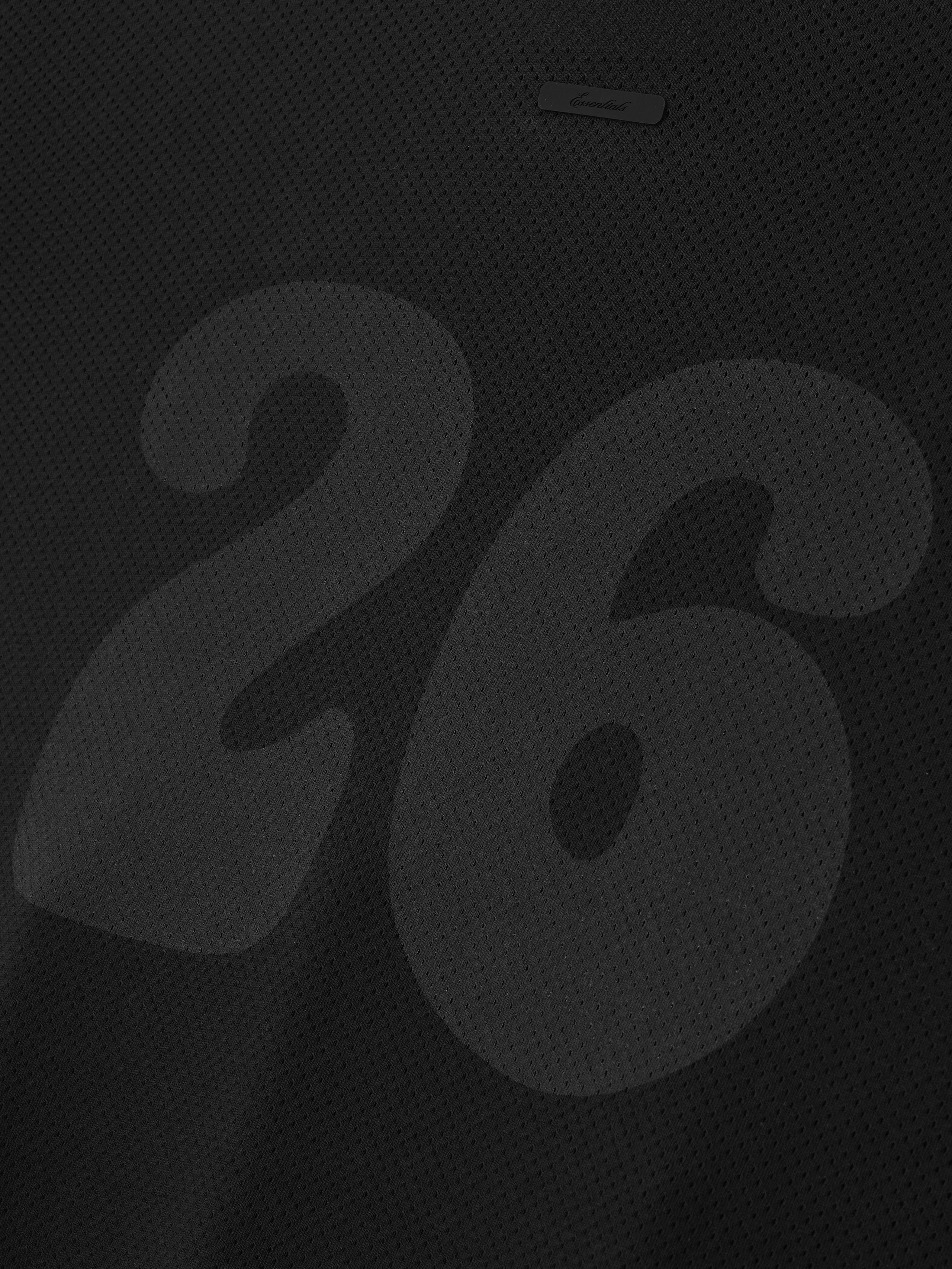 Sport Mesh Merch Tee in vintage black featuring breathable mesh fabric with a large tonal number 26 subtly printed for a sleek, understated sporty look.