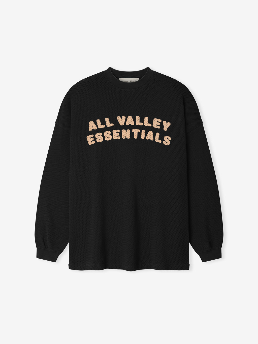 Sport Mesh Merch Long Sleeve Tee in a vintage black shade featuring soft beige "ALL VALLEY ESSENTIALS" lettering across the chest for a casual, modern top.