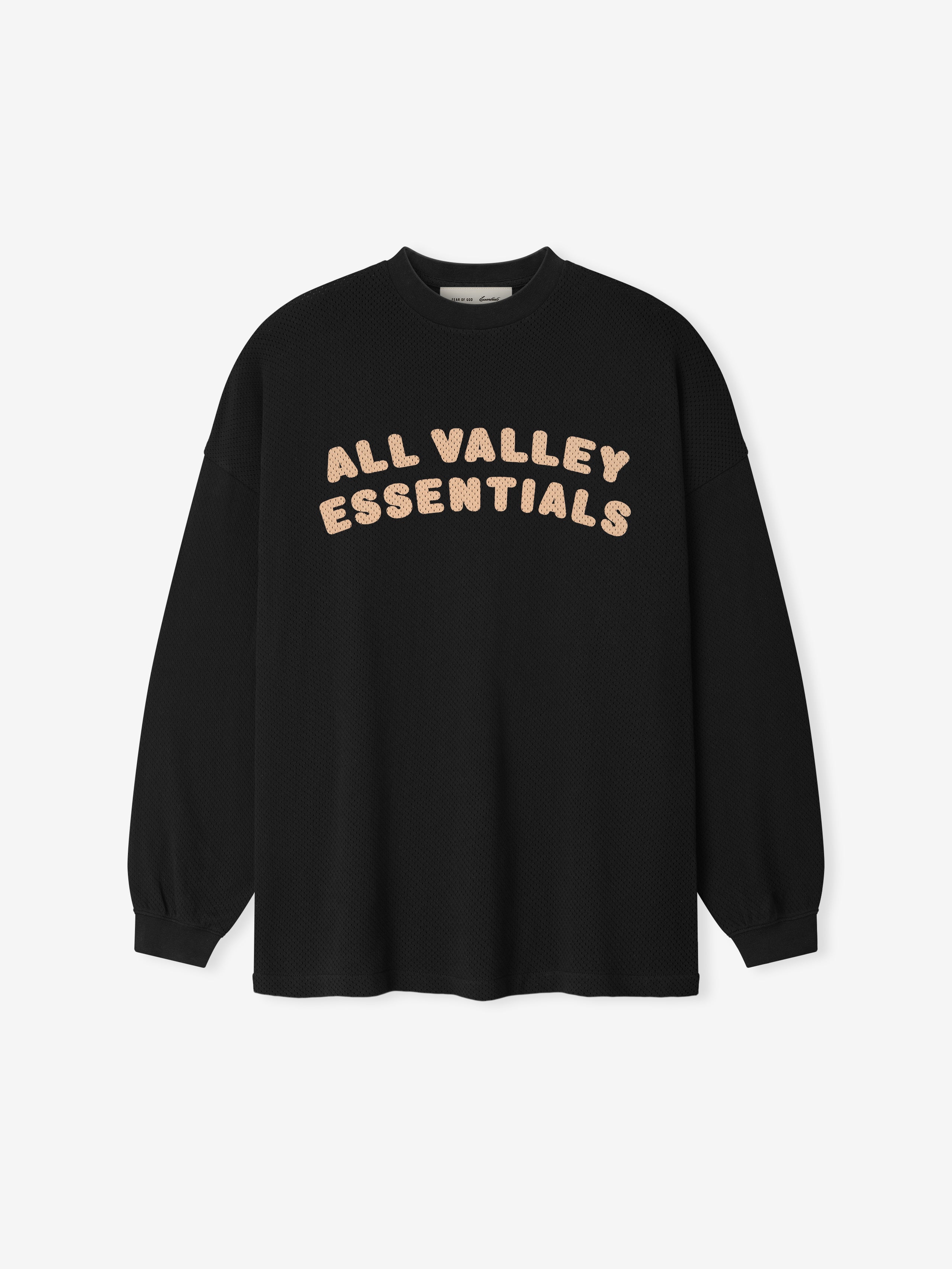 Sport Mesh Merch Long Sleeve Tee in a vintage black shade featuring soft beige "ALL VALLEY ESSENTIALS" lettering across the chest for a casual, modern top.