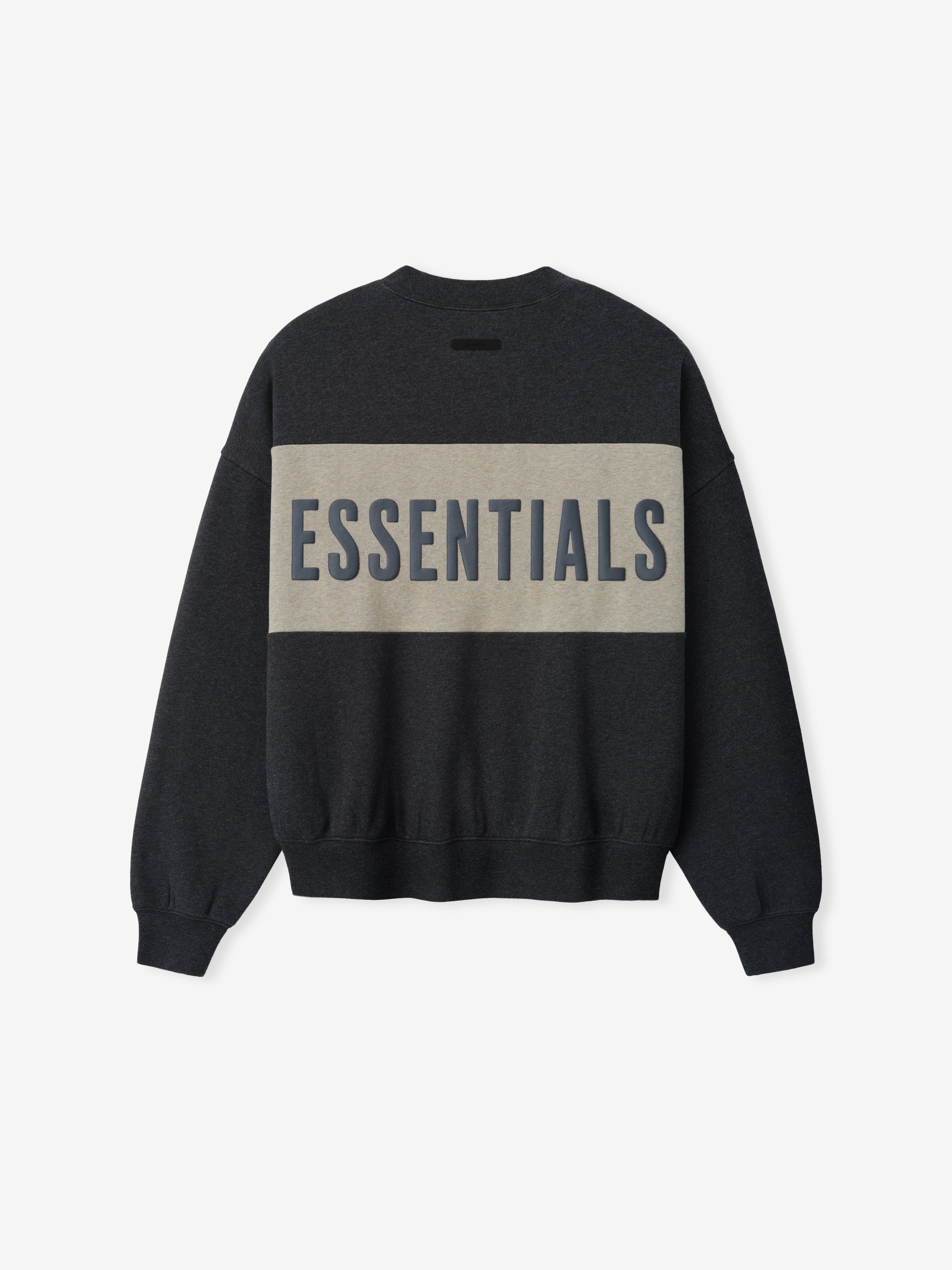 Cropped Relaxed Panelled Sweatshirt in dark charcoal with a wide muted beige horizontal panel across the back featuring bold navy "ESSENTIALS" lettering, designed with ribbed cuffs and hem for a cozy streetwear fit.