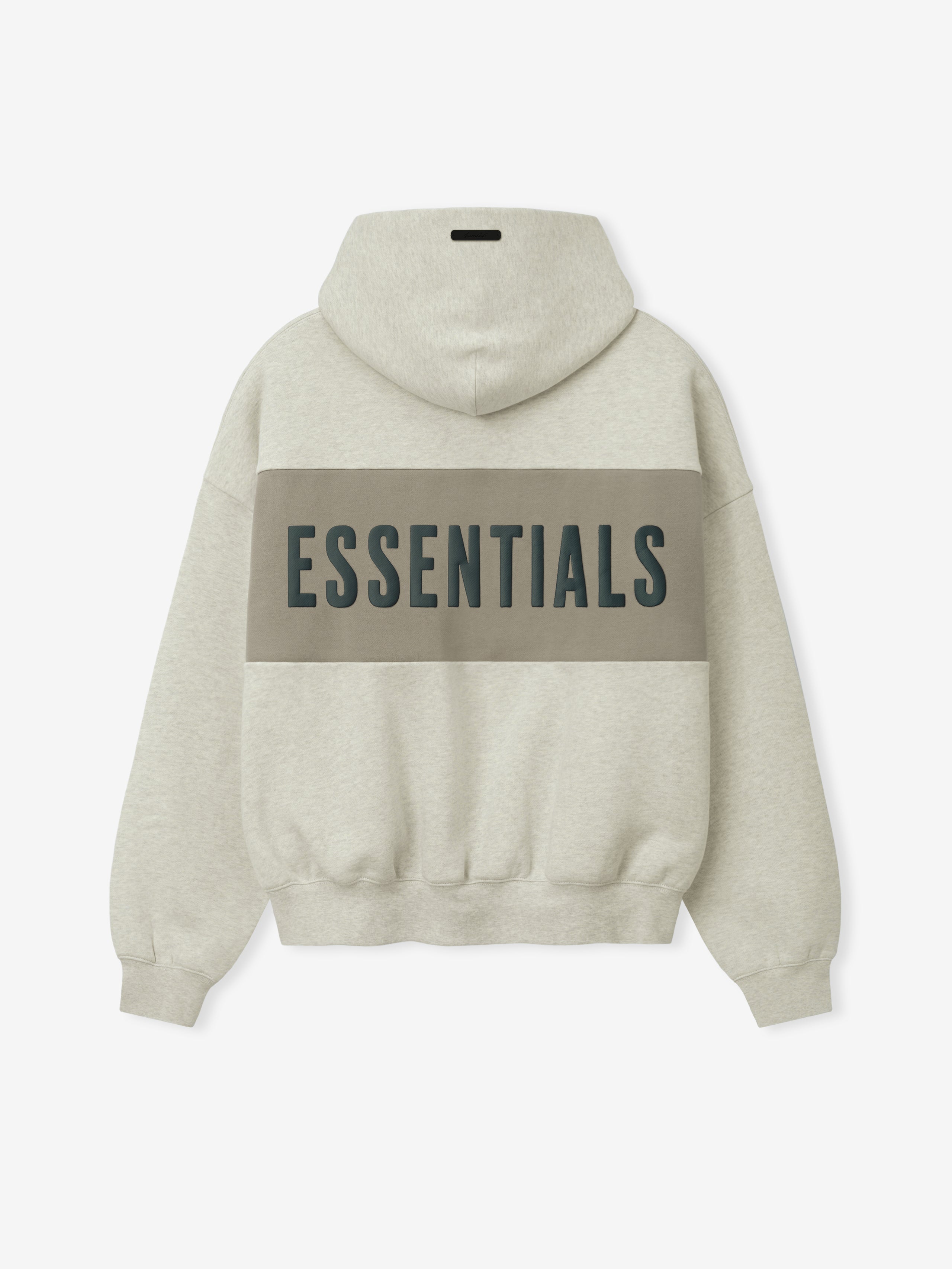 Cropped Relaxed Panelled Hoodie in a light beige tone with a wide muted taupe panel across the back featuring bold dark "ESSENTIALS" lettering, designed with ribbed cuffs and hem for a cozy fit.