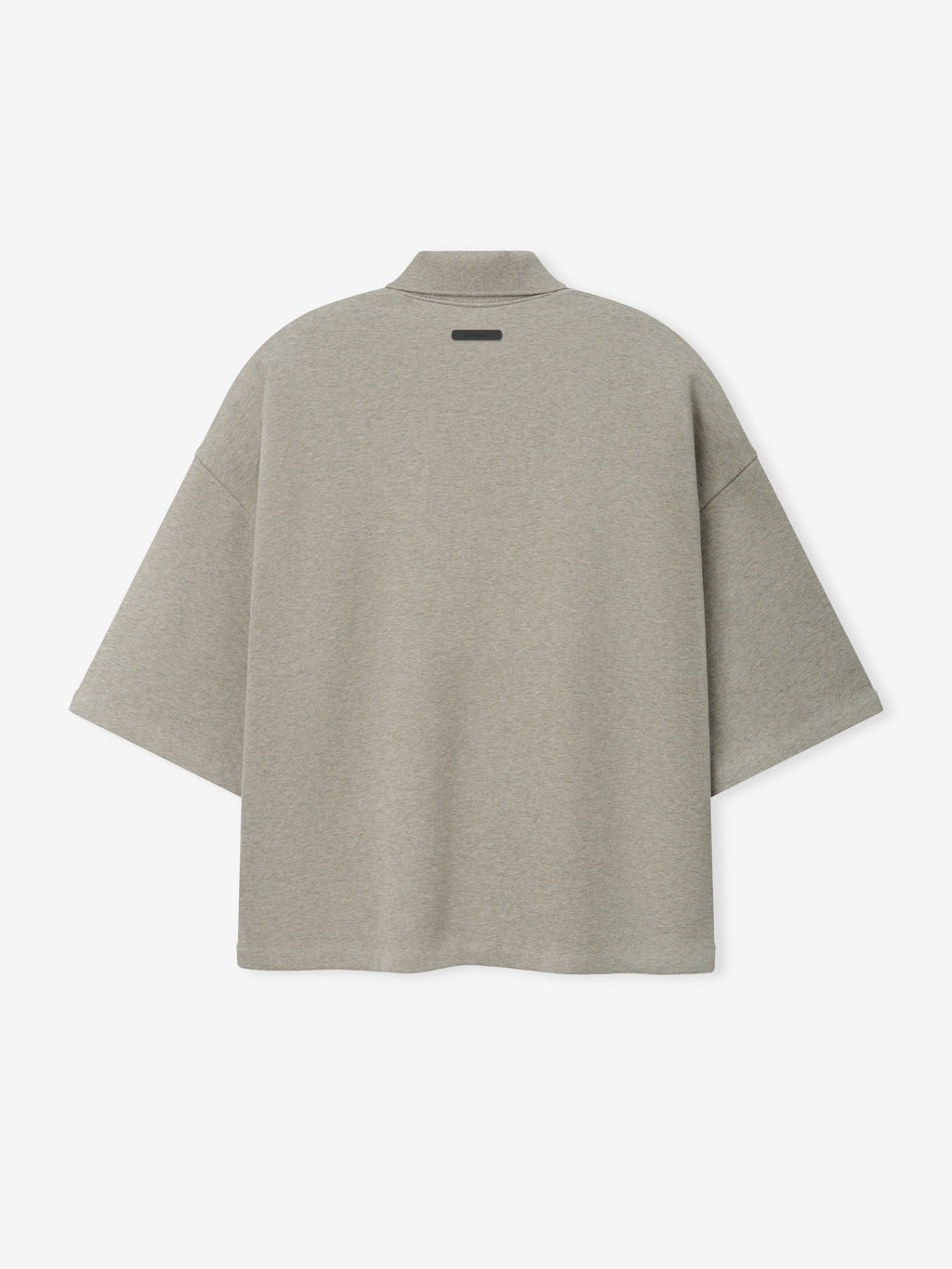 Cropped Panelled Polo in a muted seal heather tone with a relaxed, boxy fit and short sleeves, featuring a subtle collar and smooth fabric texture for modern casual tops.