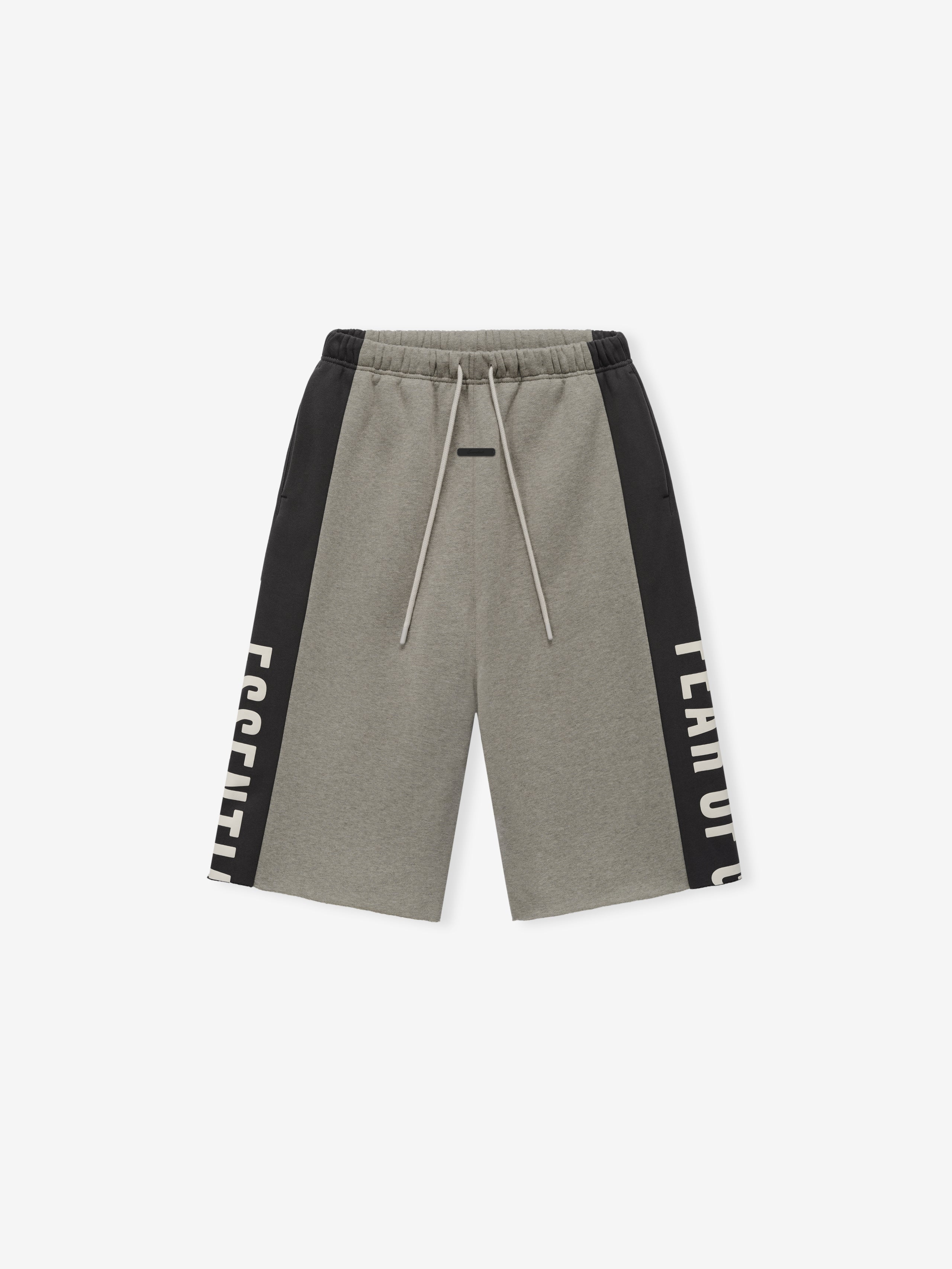 Panelled Raw Cut Off Sweatpant in a muted grey shade with contrasting black side panels featuring bold cream lettering, designed with an elastic waistband and drawstring for relaxed bottoms.