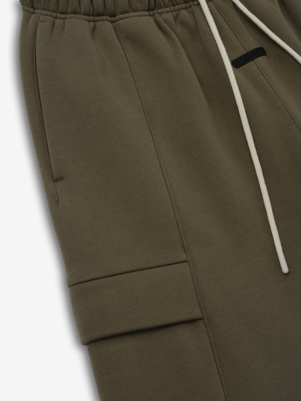 Fleece Cargo Basketball Short in deep moss green with an elastic waistband, contrasting white drawstrings, and a side flap cargo pocket for a stylish and functional bottoms choice.