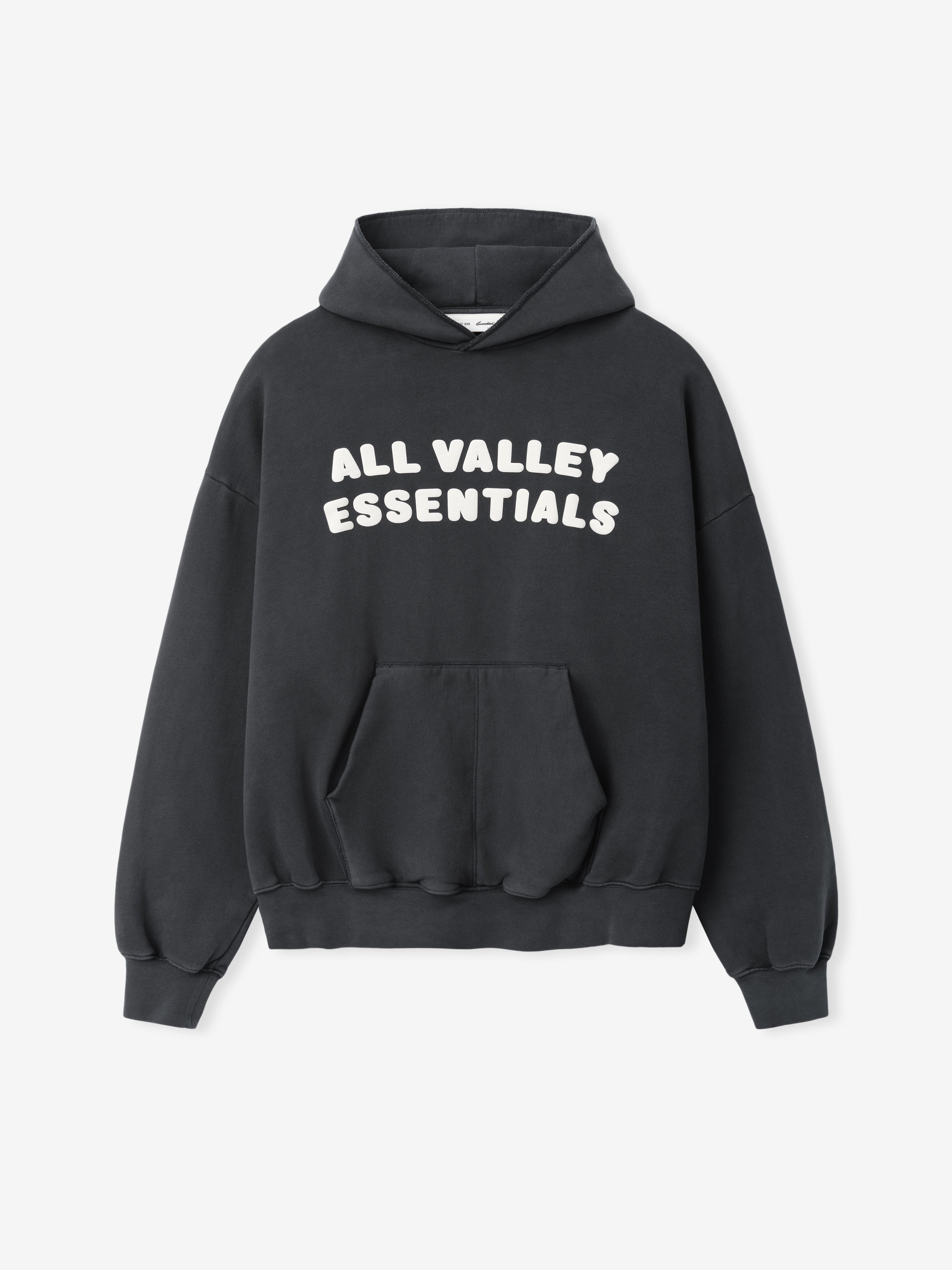 90s Hoodie in washed dark grey featuring bold white text "ALL VALLEY ESSENTIALS" across the chest, with a roomy kangaroo pocket, ribbed cuffs, and relaxed fit.
