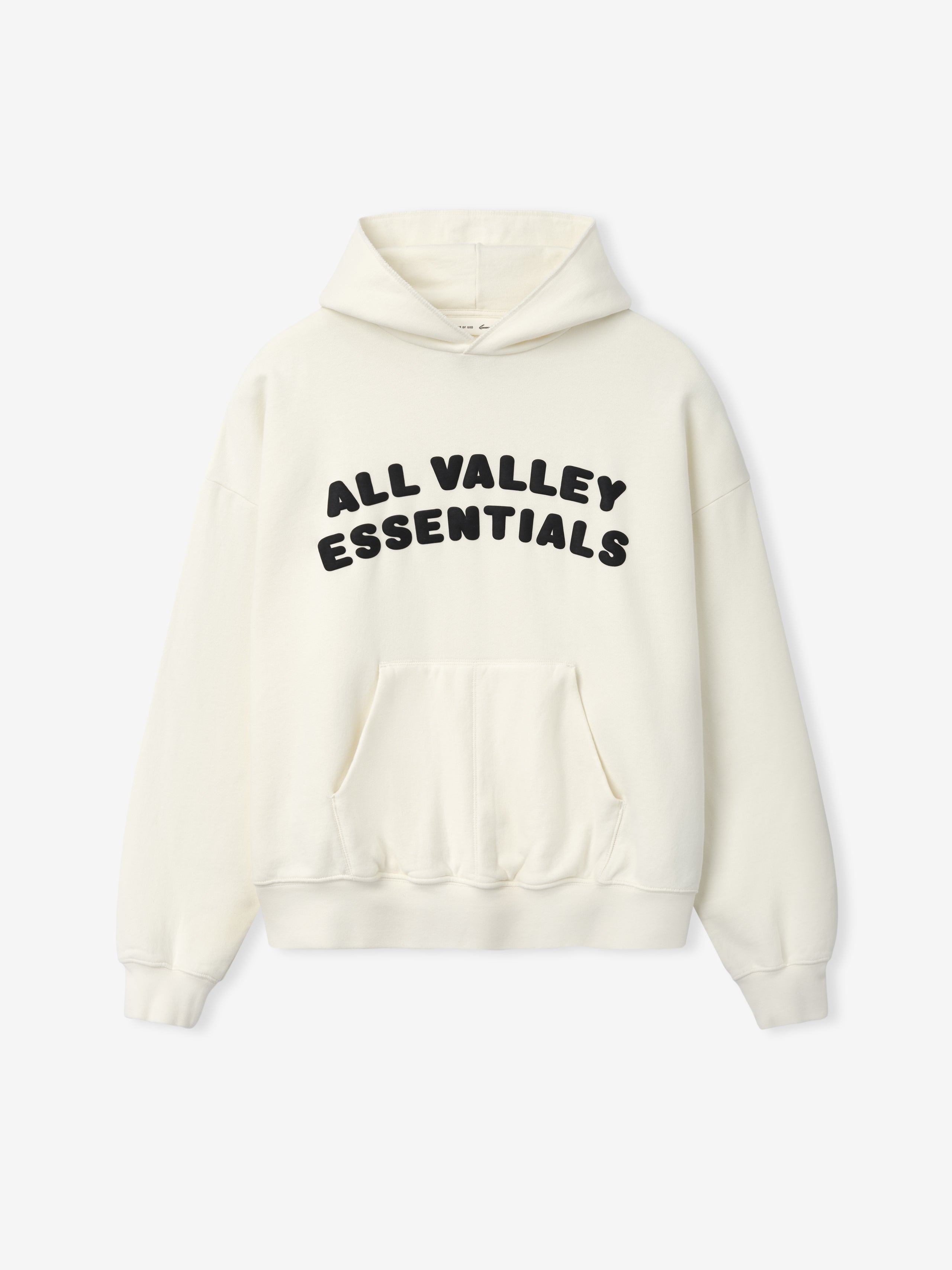90s Hoodie in a soft off-white shade with bold black "ALL VALLEY ESSENTIALS" text across the chest, featuring a roomy kangaroo pocket, ribbed cuffs, and a cozy attached hood.