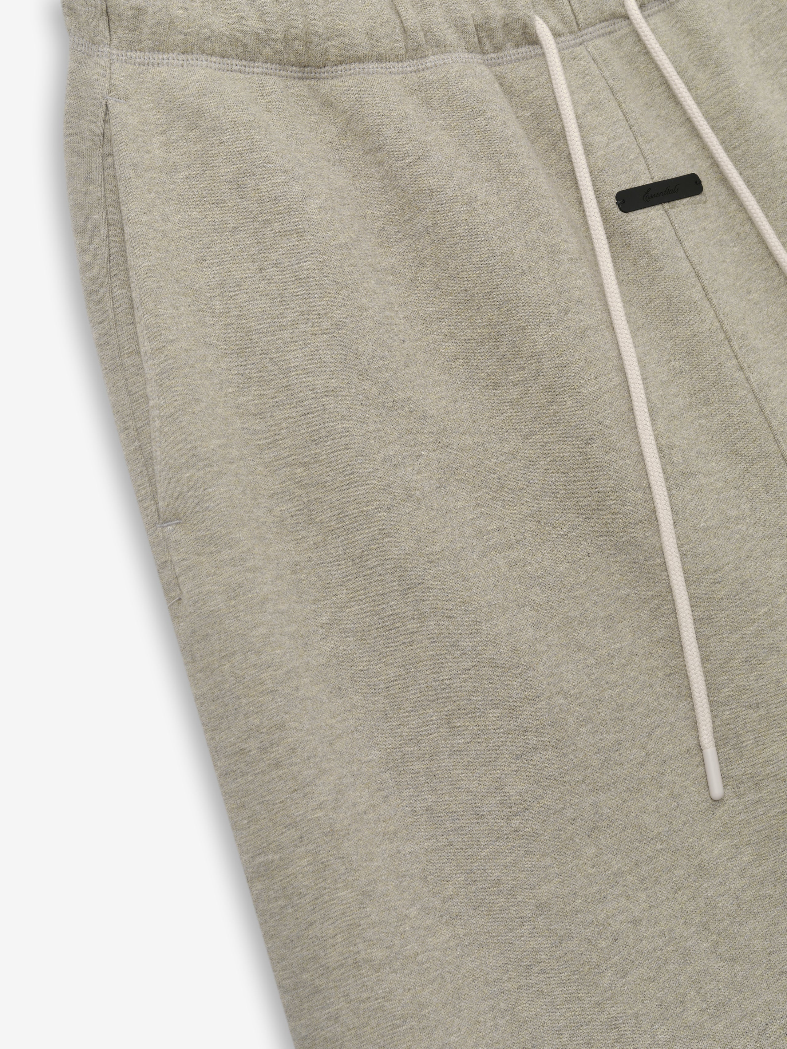 Flare Sweatpant in a light washed seal heather fabric featuring an elastic waistband with drawstrings and a side pocket for a casual and comfortable bottom option.