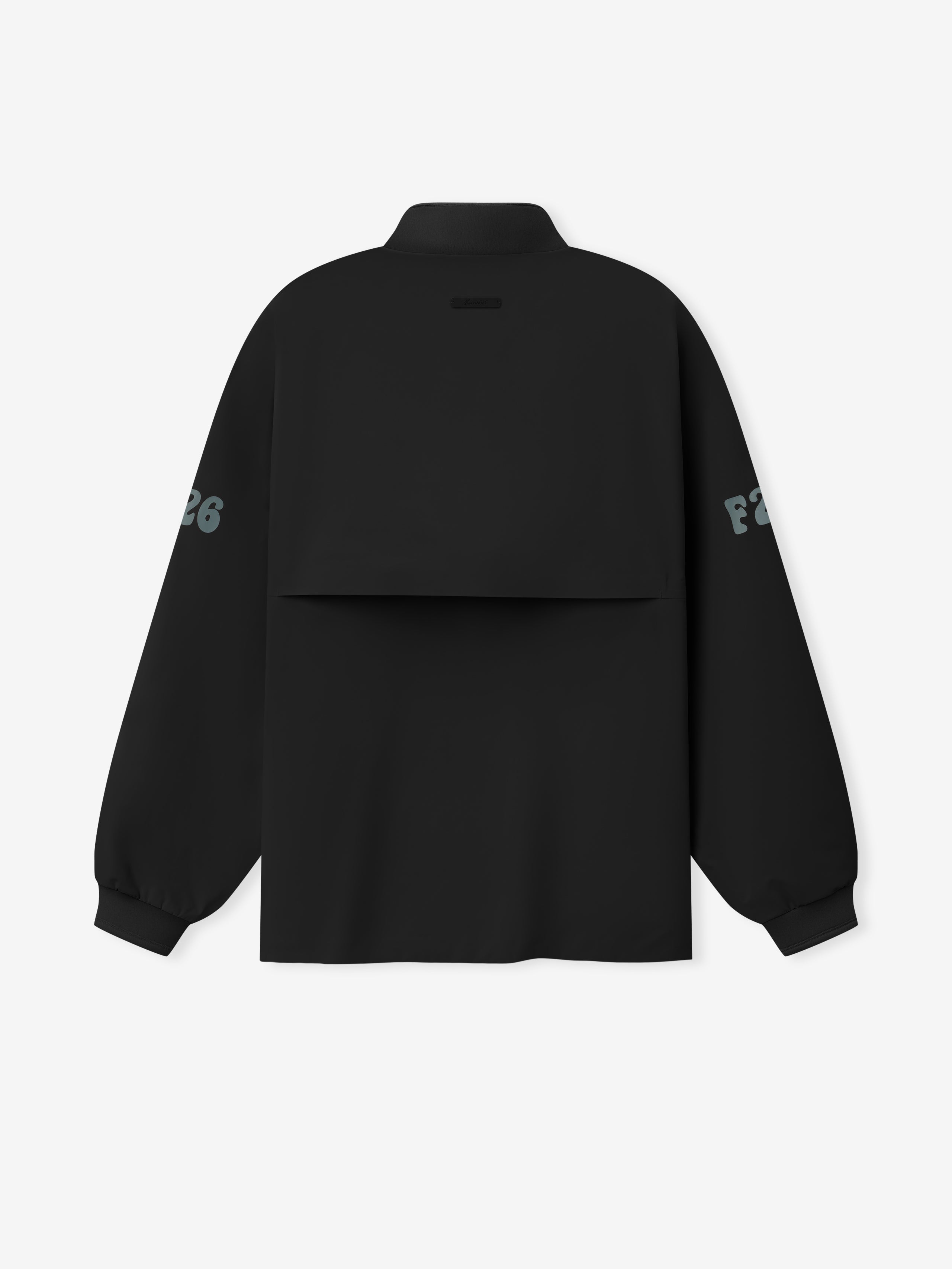 Half Zip Track Jacket in deep black with a unique layered back panel, long sleeves featuring muted printed lettering, and elasticated cuffs for a contemporary outerwear style.