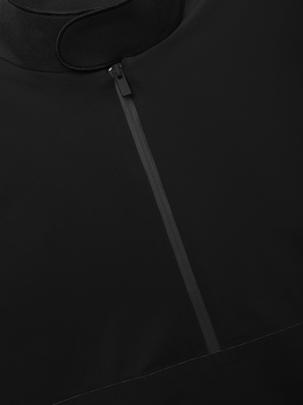 Half Zip Track Jacket in vintage black featuring a smooth fabric texture, high neckline with a locking half-zip closure for a clean and modern outerwear design.