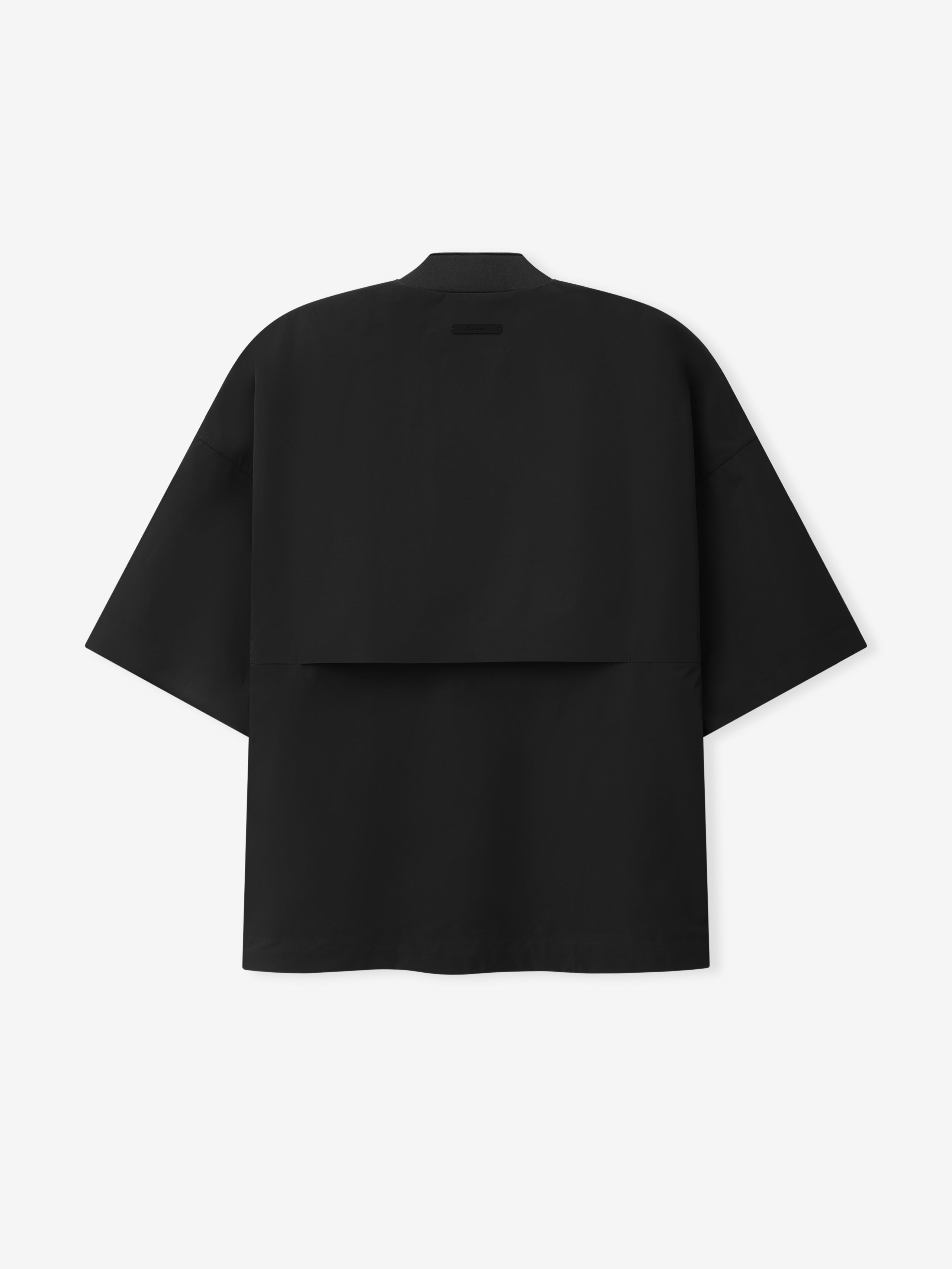 Half Zip Baseball Shirt in a vintage black shade featuring a relaxed fit with short sleeves and a layered back panel for added dimension and contemporary style.