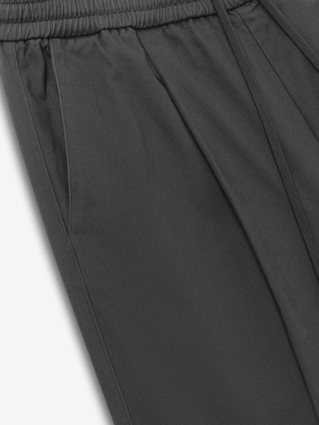 Cotton Twill Pleat Front Drawstring Pant in dark iron grey, featuring an elastic waistband with adjustable drawstring and side pockets for comfortable tailored bottoms.