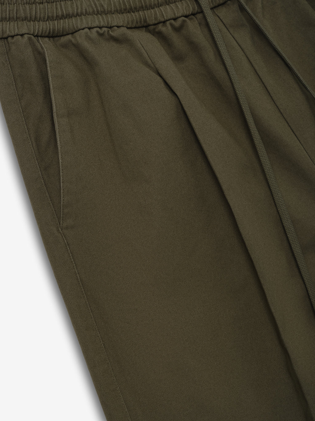 Cotton Twill Pleat Front Drawstring Pant in a muted green tone, featuring side pockets, pleated front detailing, and an elastic waistband with adjustable drawstring for casual bottoms.