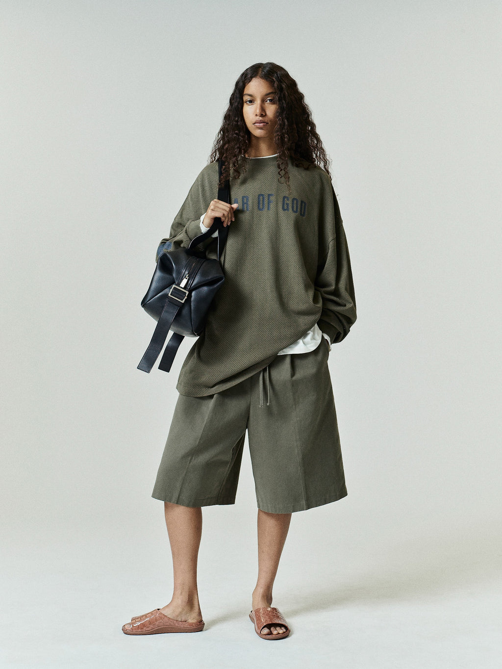 Cotton Twill Relaxed Drawstring Short in a muted moss green shade, featuring a loose fit with an adjustable drawstring waistband and side pockets for casual bottoms.