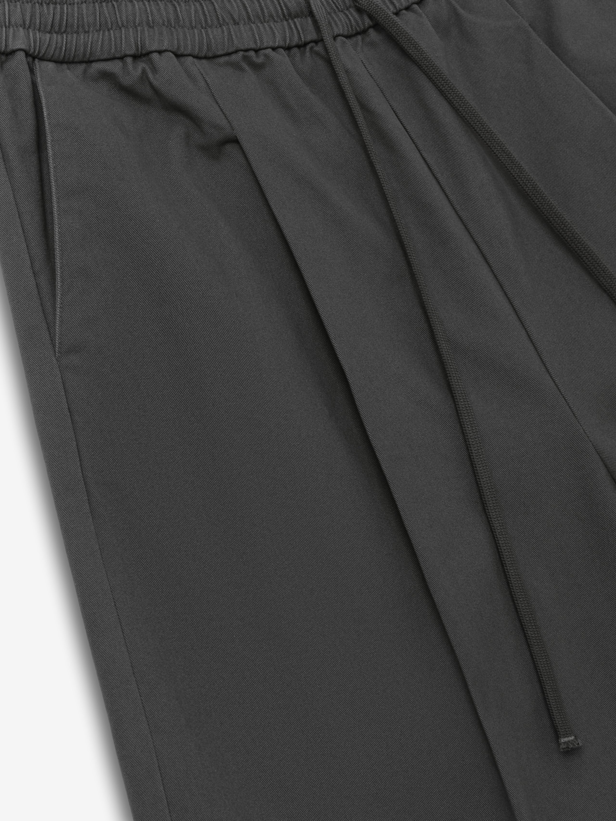 Cotton Twill Relaxed Drawstring Short in a dark iron grey shade, featuring an elastic waistband with adjustable drawstrings and soft cotton twill fabric for casual bottoms.