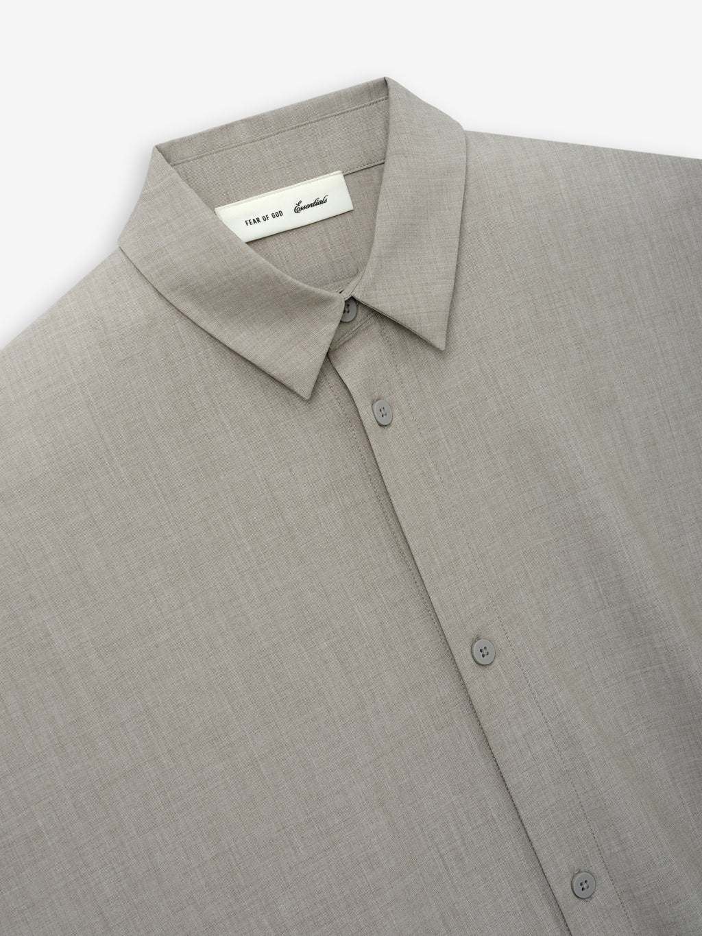 Close-up of the upper front section of a Silk Blend 3/4 Sleeve Button Up Shirt in a neutral, muted tone, showcasing a pointed collar and minimal button details for a refined look.