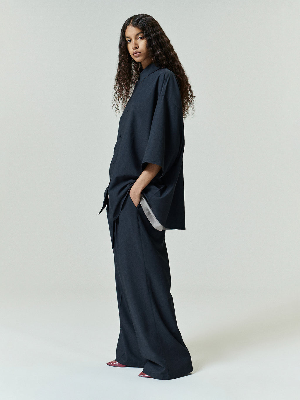 Silk Blend Pleat Front Drawstring Pant in vintage black, featuring a relaxed wide-leg silhouette with subtle pleating and an adjustable drawstring waist for elevated suiting bottoms.