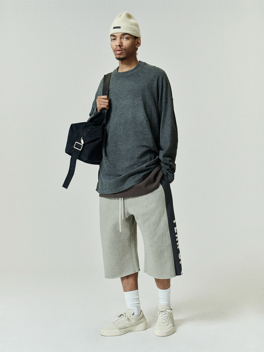 Soft Knit Long Sleeve Tee in a deep charcoal shade, crafted from soft knit fabric with a relaxed fit and classic round neckline for casual, comfortable layering tops.