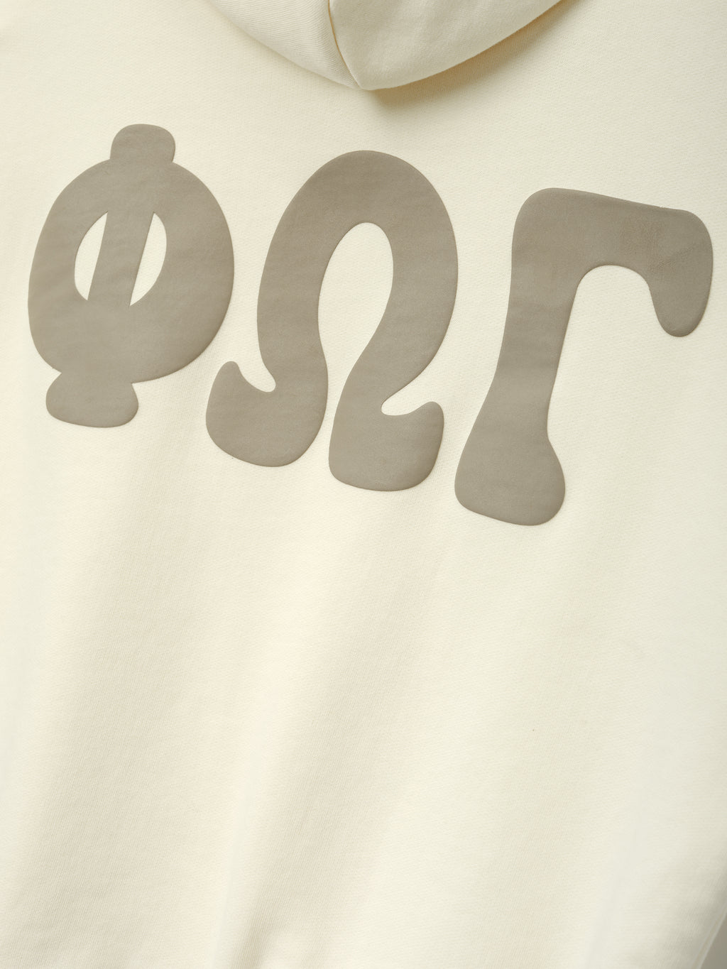 Womens 90s Fleece Hoodie in washed ivory featuring oversized soft graphic letters in a muted taupe tone across the back, highlighting a vintage-inspired casual top.