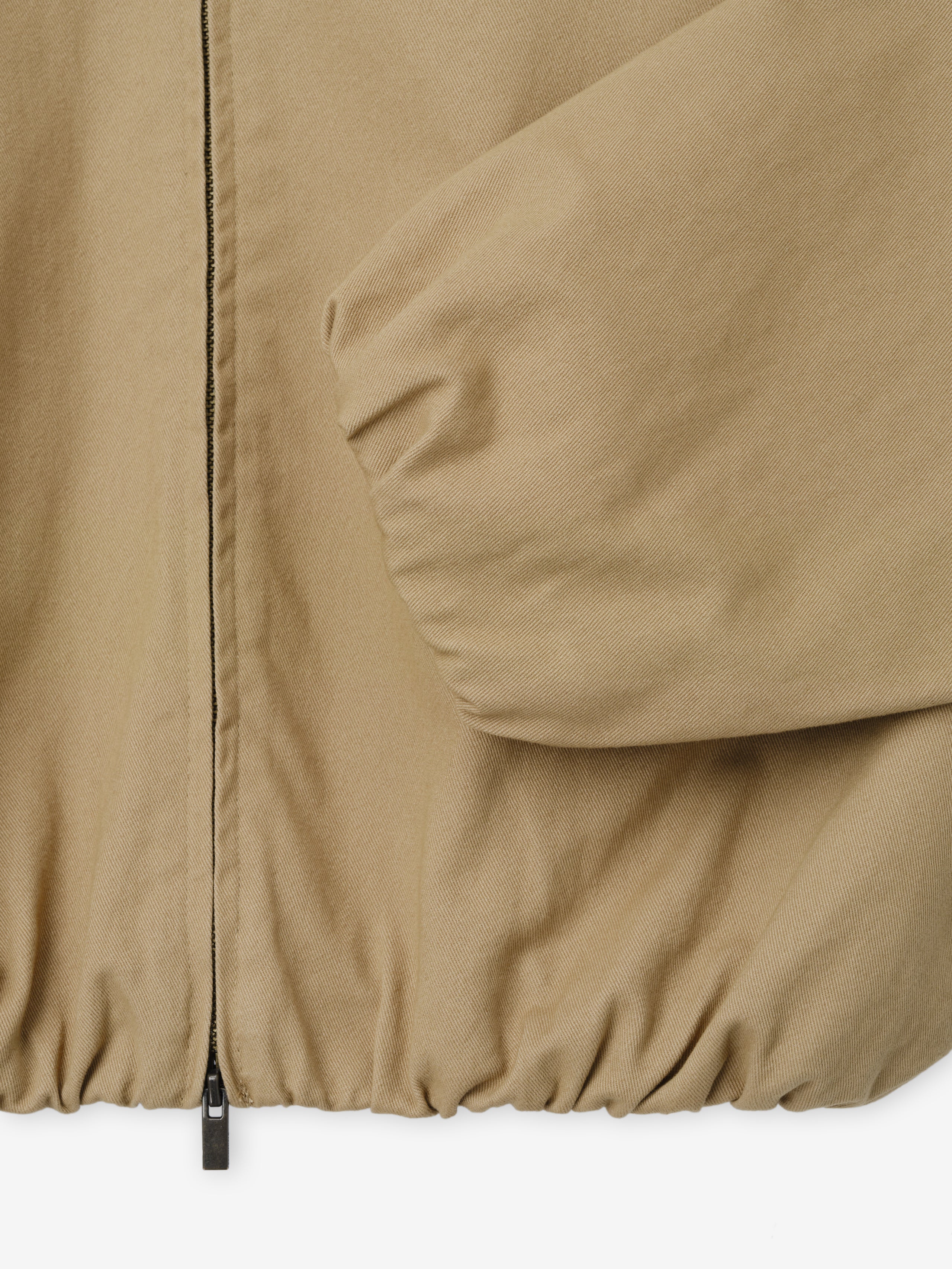 Womens Cotton Twill Work Jacket in a warm dune tone showcasing elasticized cuffs and hem with a full front zipper for functional and stylish outerwear layering.