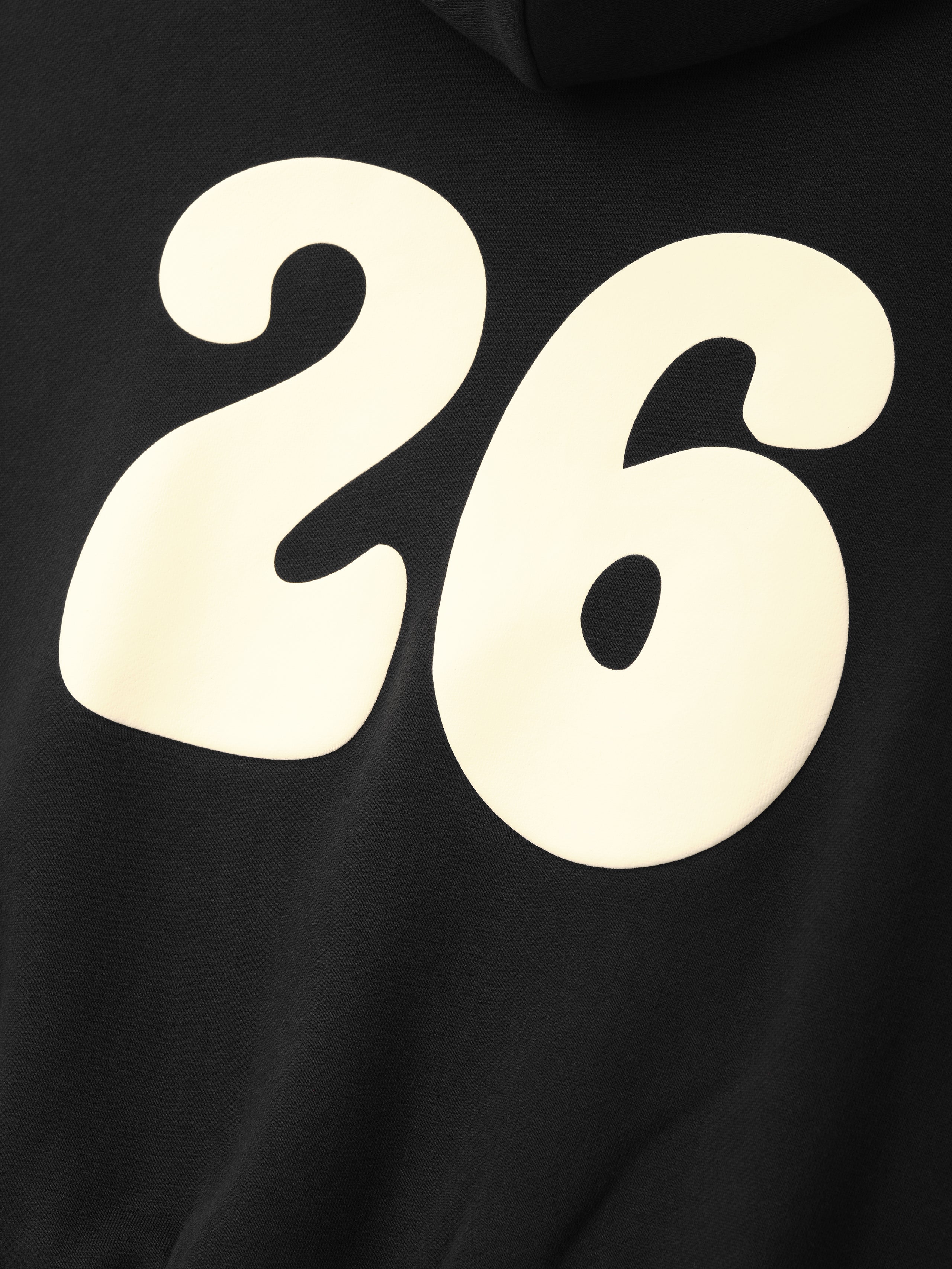 Kids 90'S Hoodie in vintage black featuring a large cream "26" graphic on the back, designed with a soft fabric perfect for comfortable and casual outerwear.