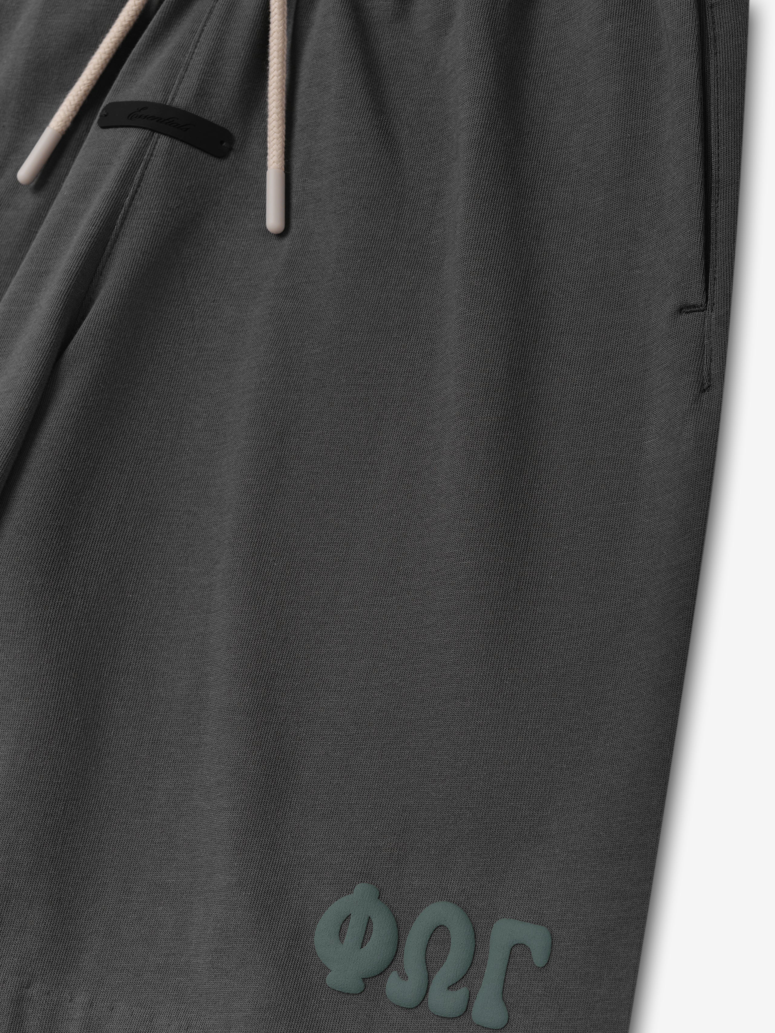 Kids 90'S Jersey Sweatshort in iron grey featuring a soft fabric with an adjustable drawstring waistband and subtle branded detailing near the hem for casual bottoms.