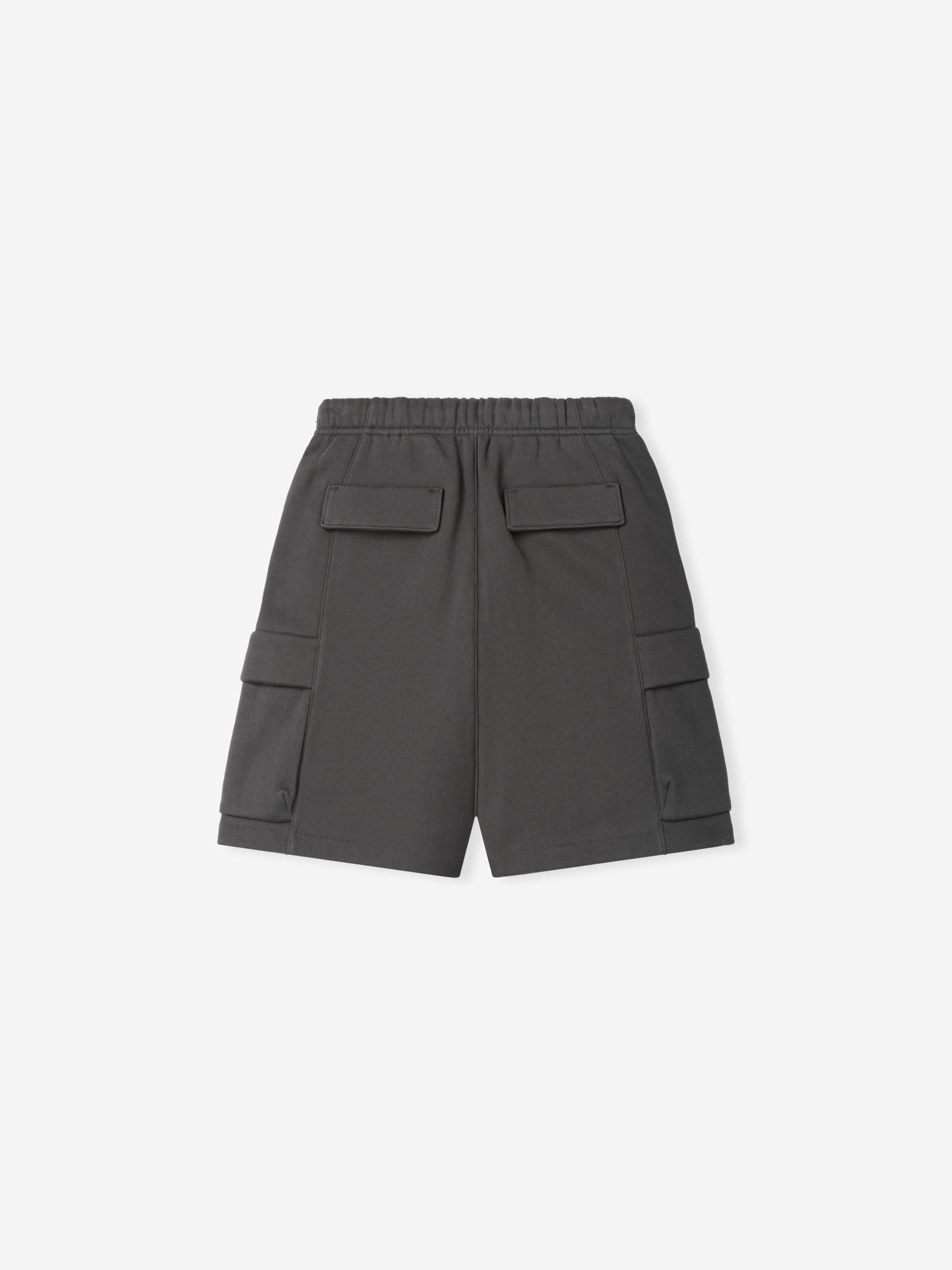 Kids Fleece Cargo Basketball Short in a dark grey tone featuring a comfortable elastic waistband, large cargo pockets on the sides, and flap pockets on the back for practical casual bottoms.