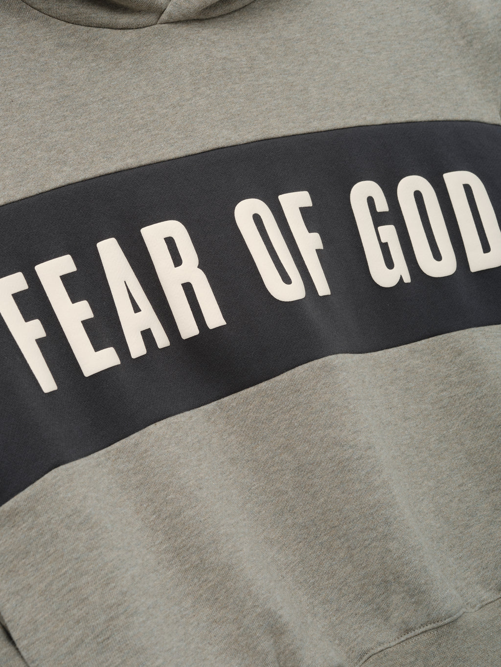 Kids Cropped Relaxed Panelled Hoodie in a muted grey with a wide dark grey panel across the chest showcasing bold "Fear of God" lettering for a trendy kids outerwear top.