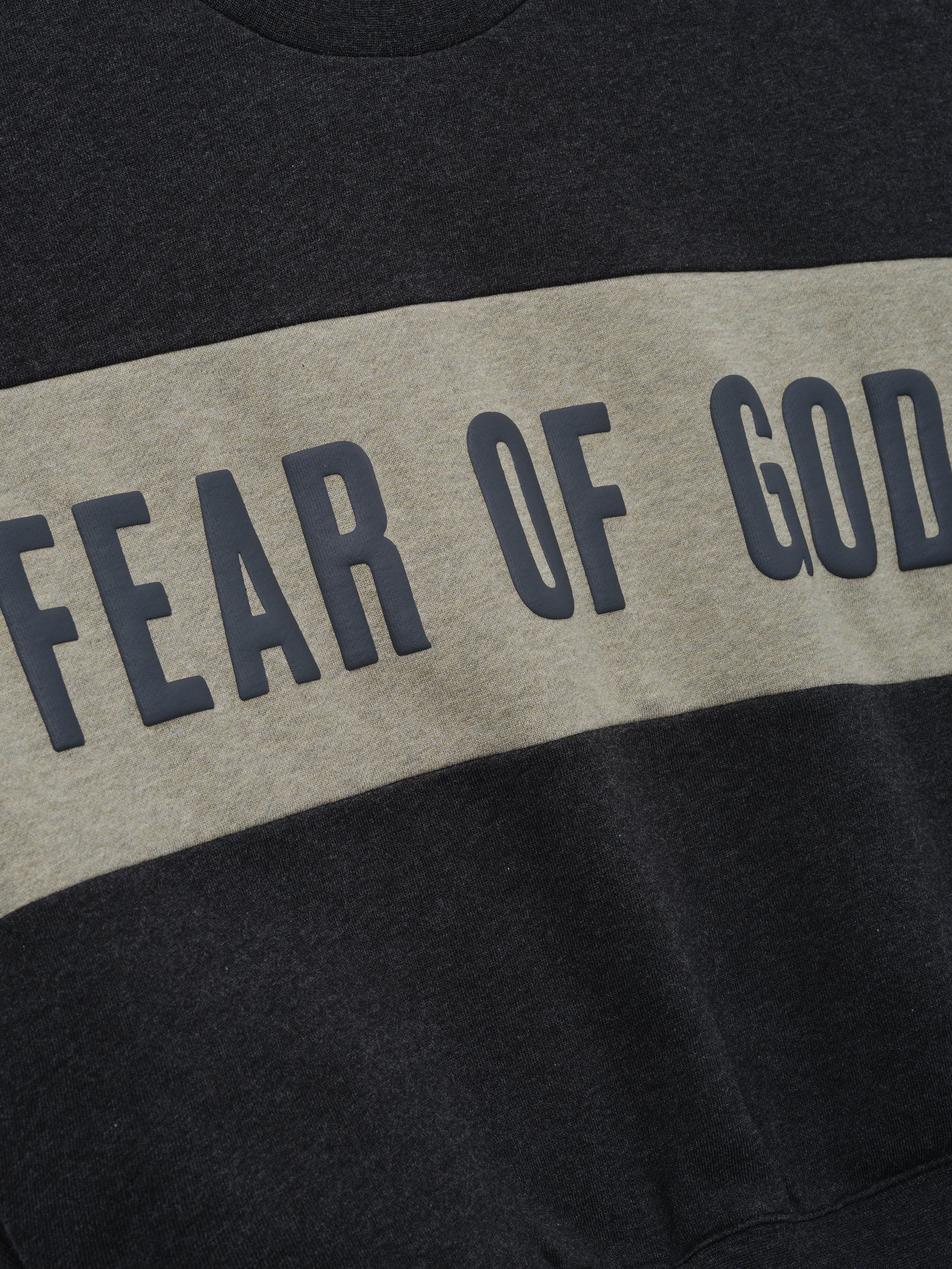 Kids Cropped Relaxed Panelled Sweatshirt featuring a wide muted grey panel across the chest with bold raised "Fear of God" lettering in dark charcoal outerwear for kids.