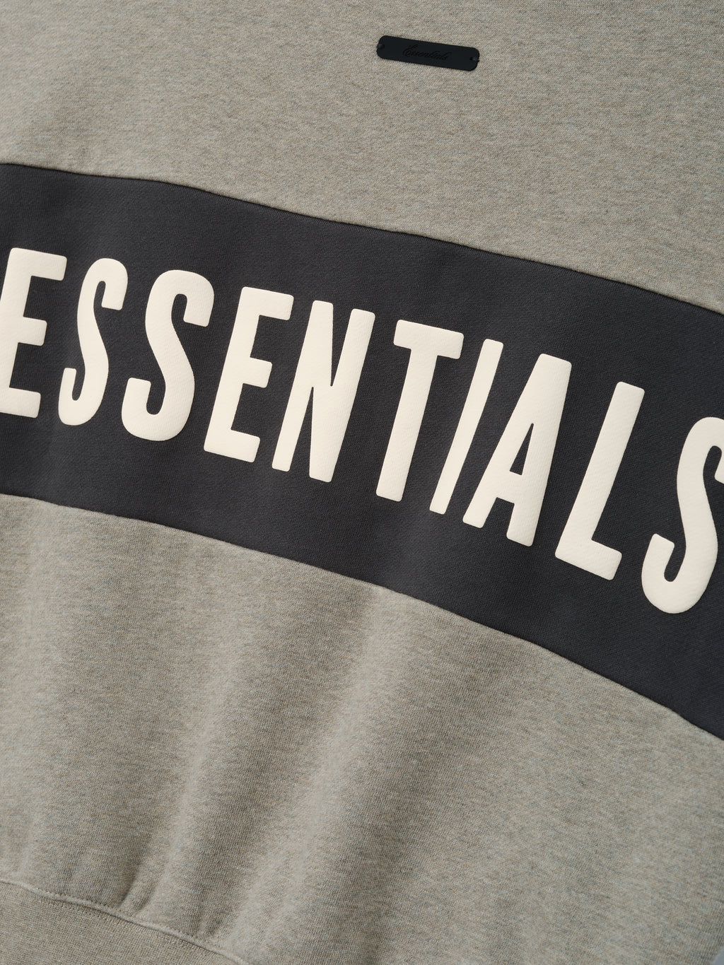 Kids Cropped Relaxed Panelled Sweatshirt in soft seal heather with a wide iron grey panel across the chest featuring bold ESSENTIALS lettering for comfortable kids outerwear.