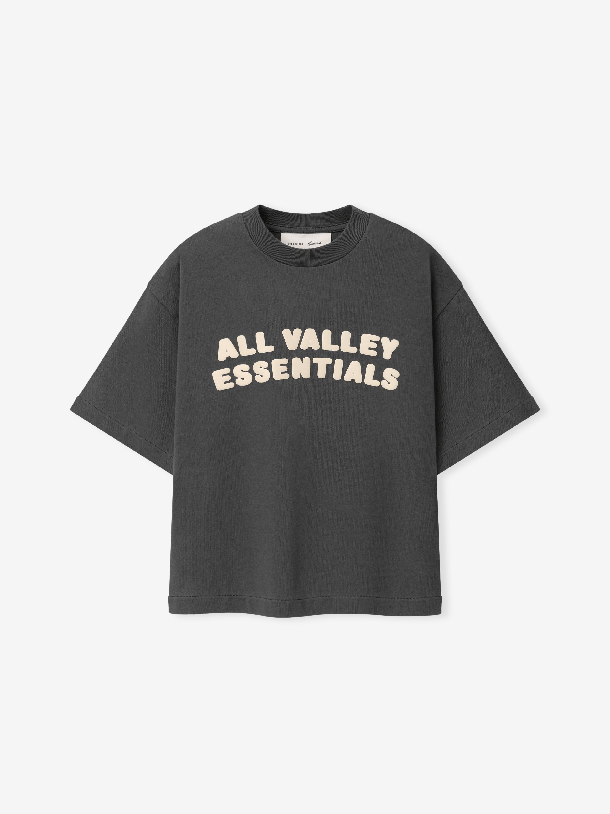 Kids Merch Tee in dark gray fabric featuring cream-colored bold text "ALL VALLEY ESSENTIALS" in playful rounded font across the chest for a casual kids top.