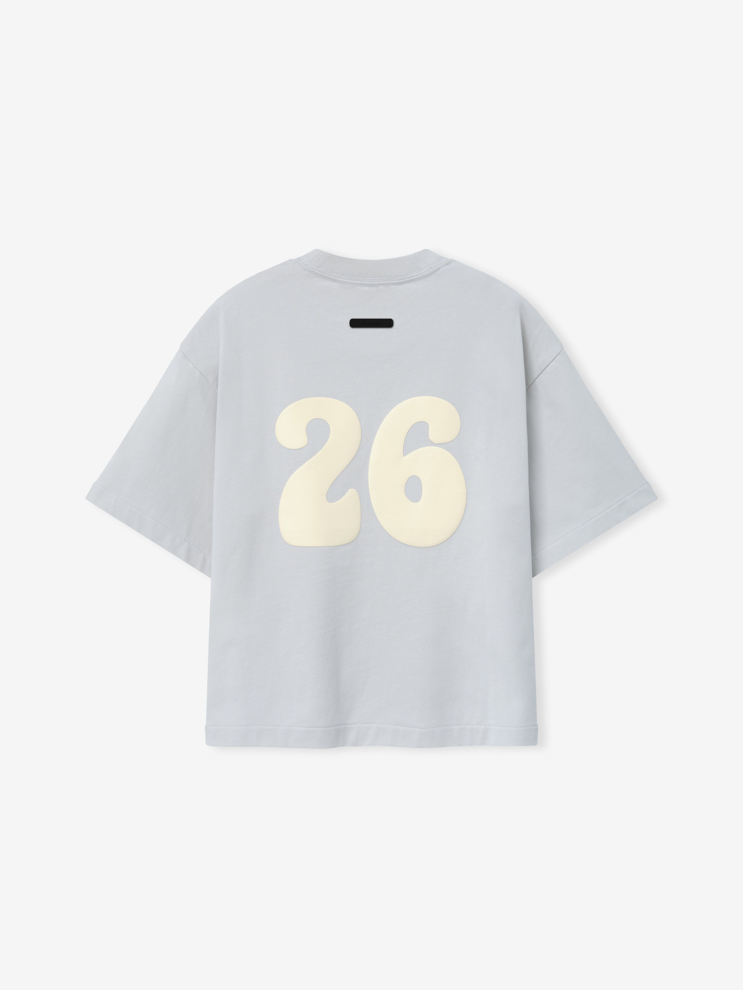 Kids Merch Tee in soft light gray fabric featuring large cream-colored number "26" in a rounded, playful font on the back for a sporty casual kids top.