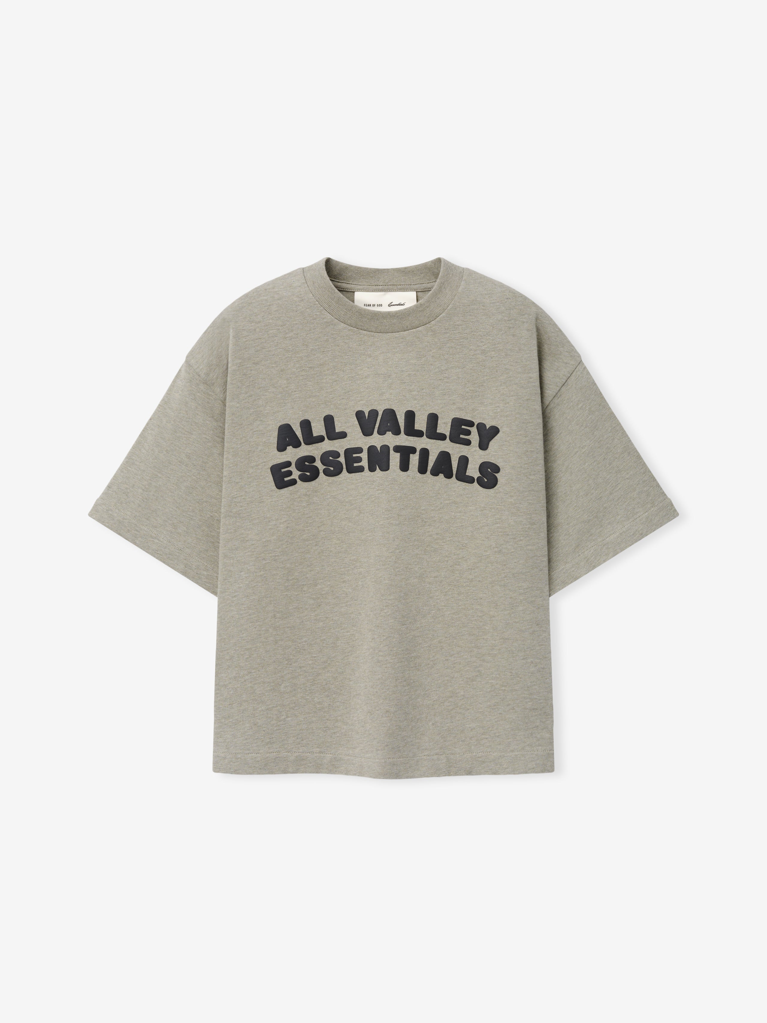 Kids Merch Tee in soft muted gray fabric featuring bold black rounded text "ALL VALLEY ESSENTIALS" in a curved layout for a casual, comfortable kids' top.