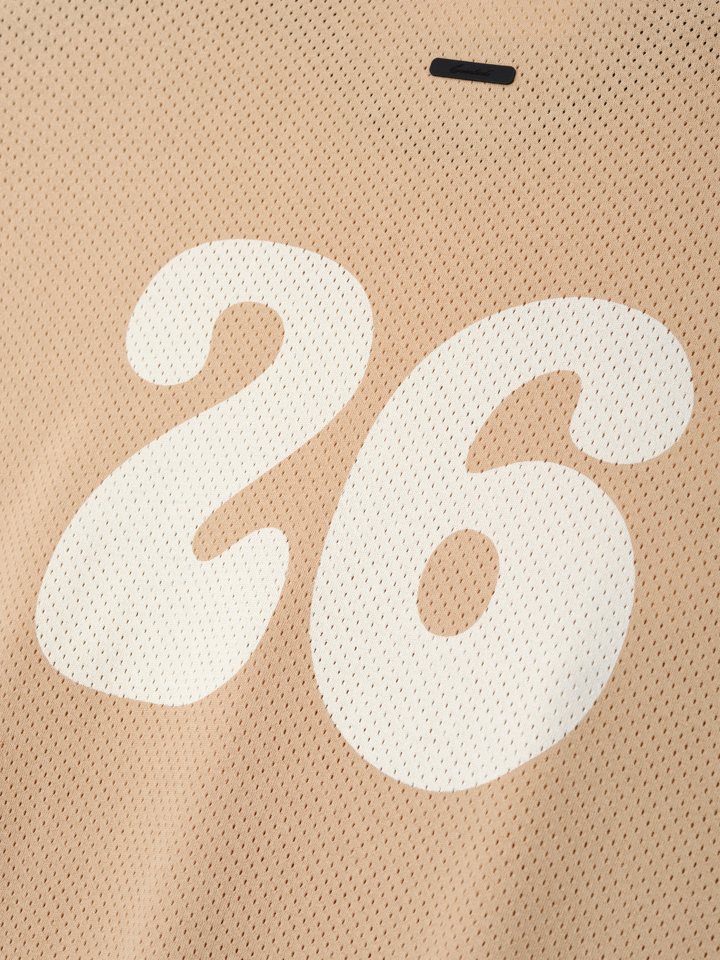 Womens Sport Mesh Merch Tee in warm neutral tone featuring lightweight breathable mesh fabric with a large white number 26 printed on the back for a sporty casual top.