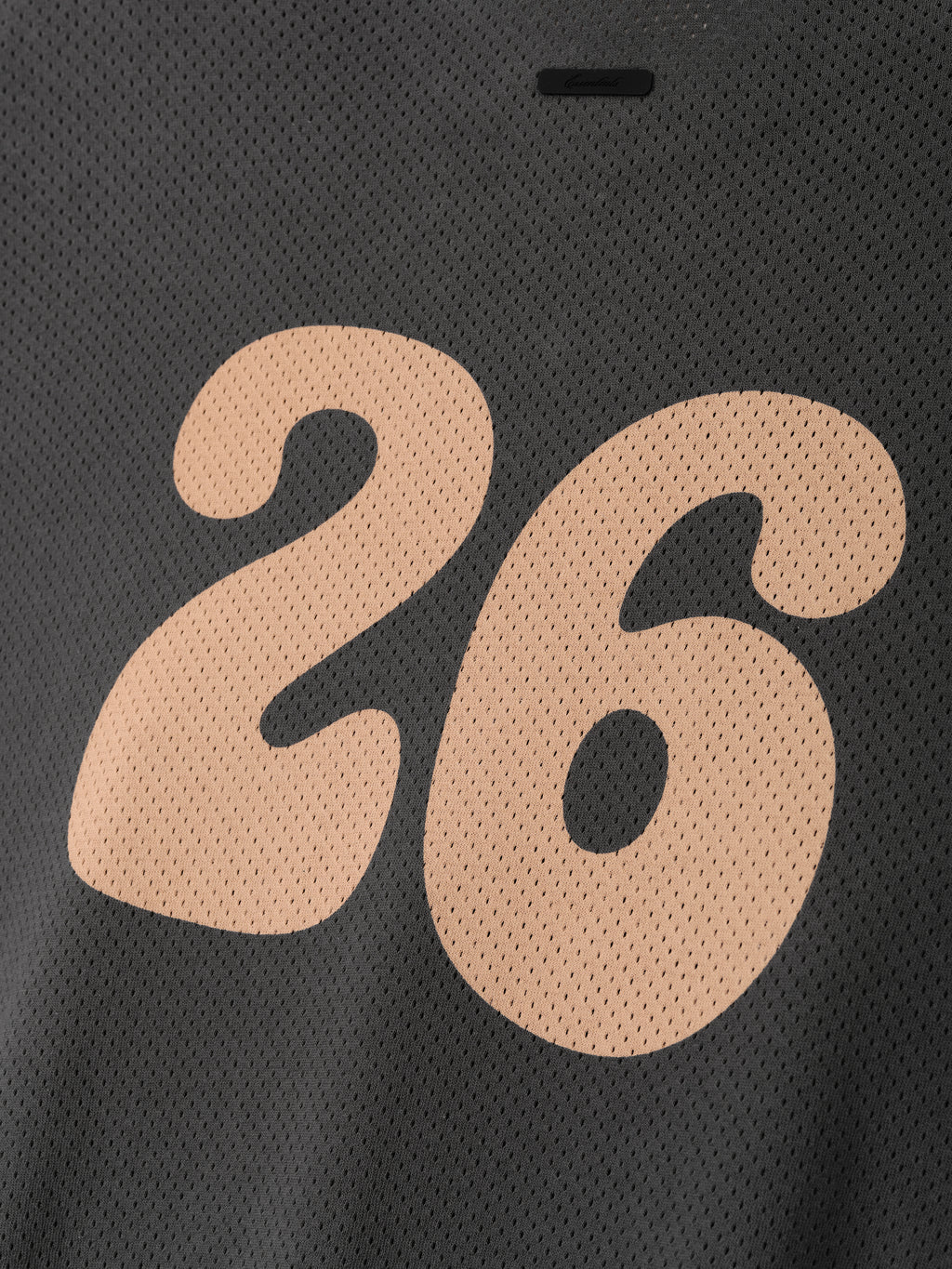 Womens Sport Mesh Merch Tee in dark grey featuring lightweight breathable mesh fabric with a large stylized peach number 26 printed on the back for a sporty casual top.