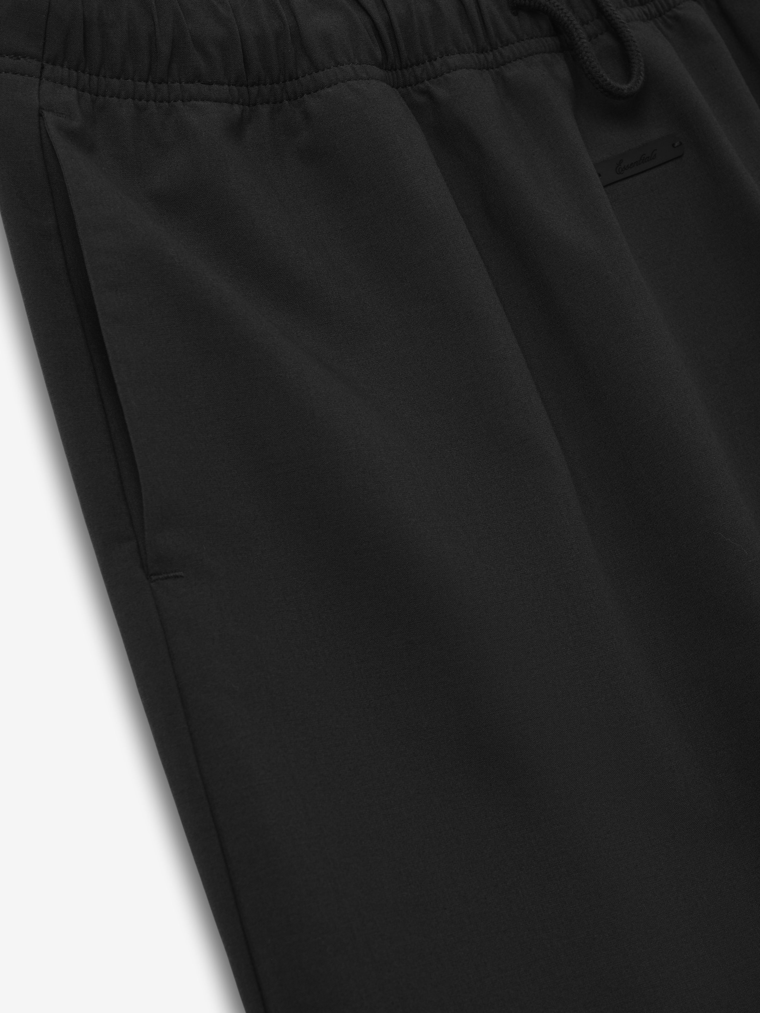 Womens Silk Blend Micro Skirt in vintage black featuring a smooth silk blend fabric with an elastic waistband and discreet pocket details for a comfortable, chic bottom piece.