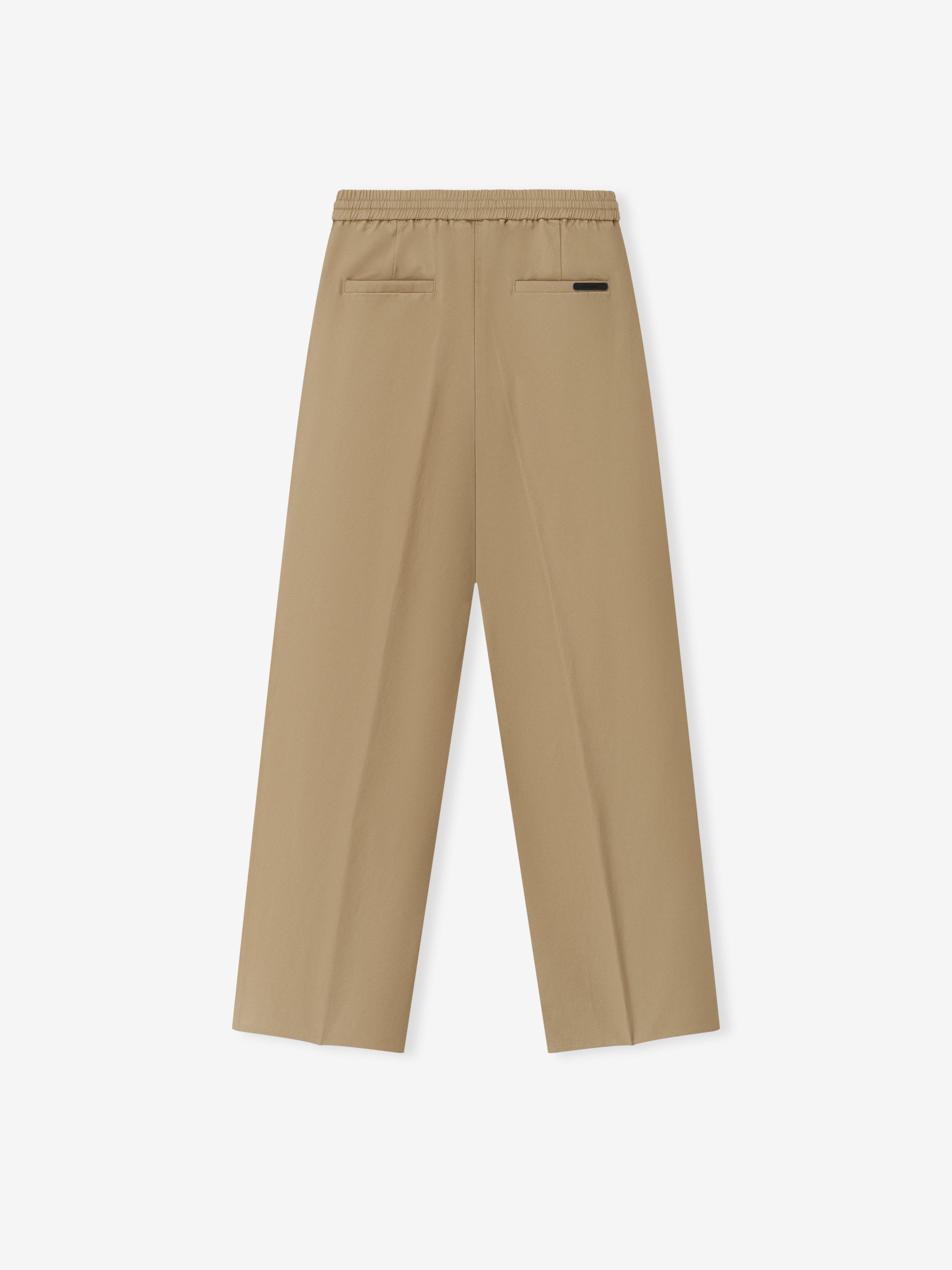 Womens Cotton Twill Pleat Front Drawstring Pant in a soft dune color, featuring back welt pockets, an elastic waistband with drawstring, and a relaxed straight leg fit for versatile bottoms.