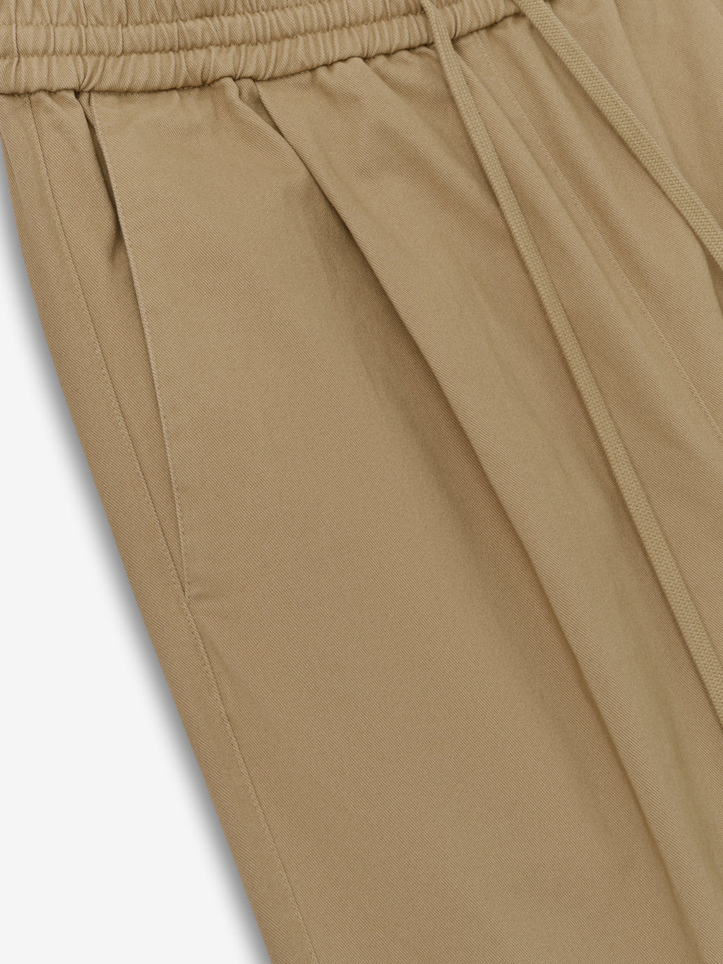 Womens Cotton Twill Pleat Front Drawstring Pant in a warm beige tone, featuring side pockets, front pleating, and an elastic waistband with adjustable drawstring for comfortable casual bottoms.