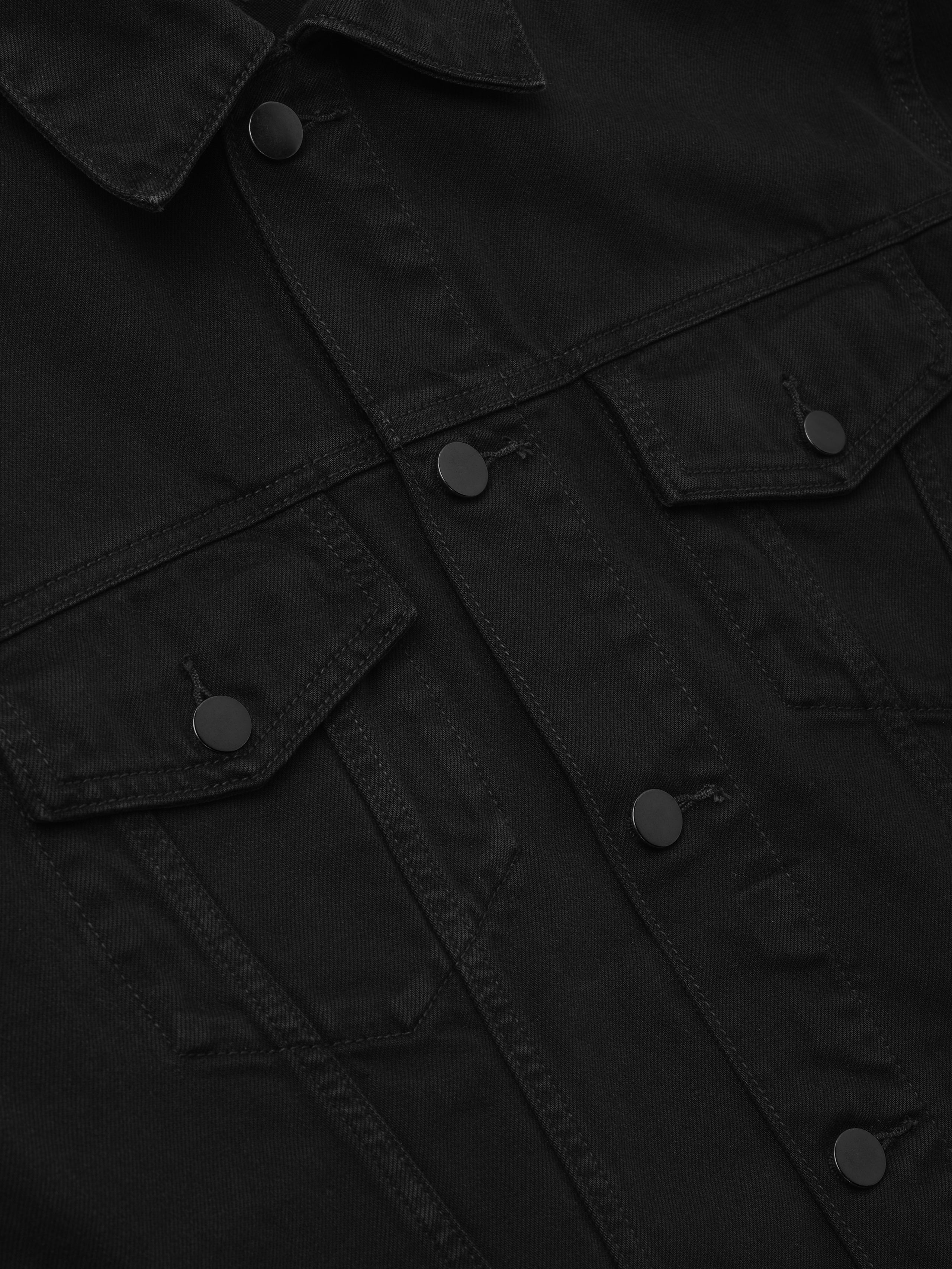 Classic Denim Jacket in a deep black shade featuring a pointed collar, metal button closures, flap chest pockets, and sturdy denim fabric for durable outerwear layering.