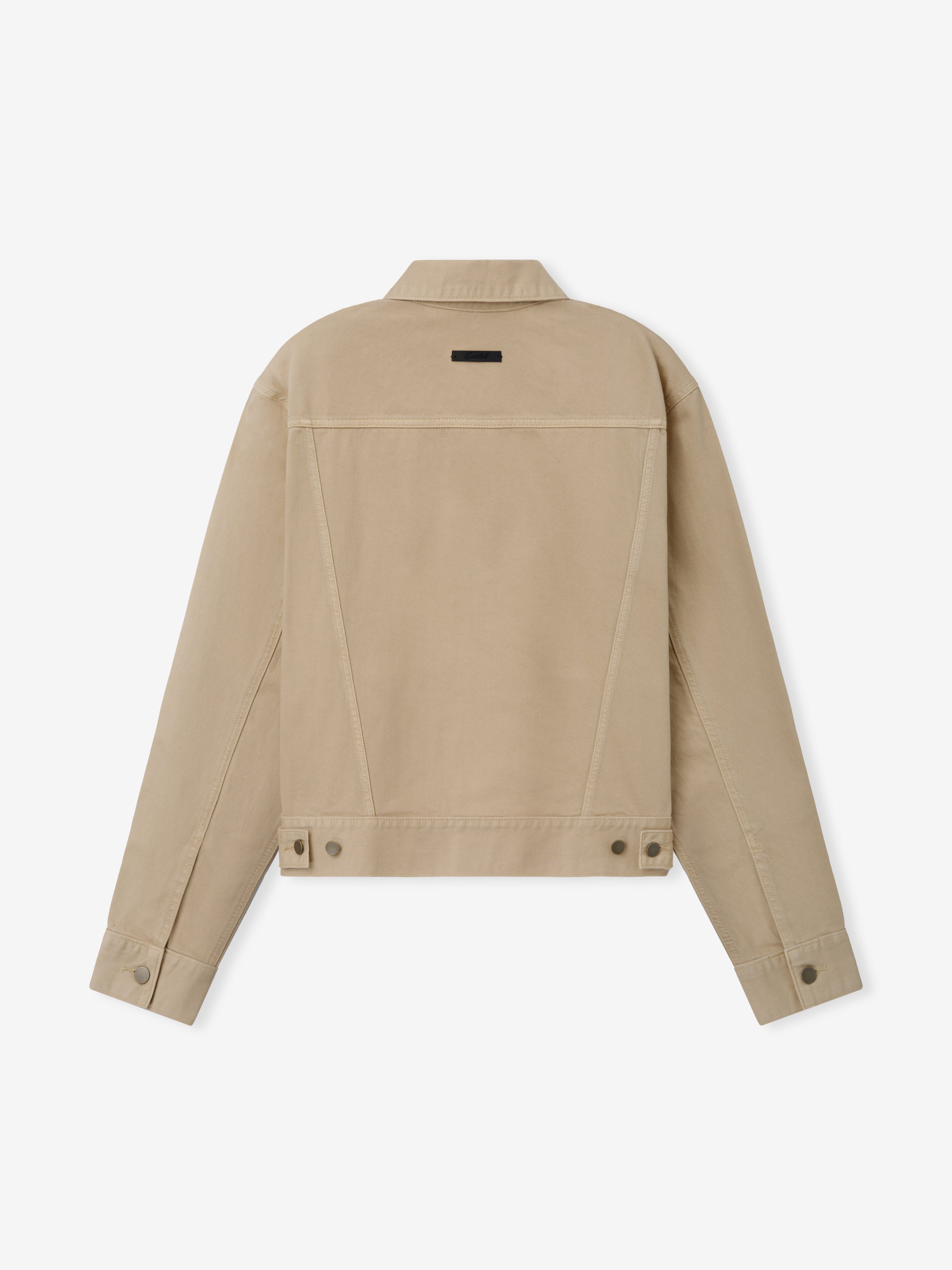 Classic Denim Jacket in a muted beige tone featuring a clean back design, adjustable waistband tabs, buttoned cuffs, and durable denim fabric for versatile outerwear layering.