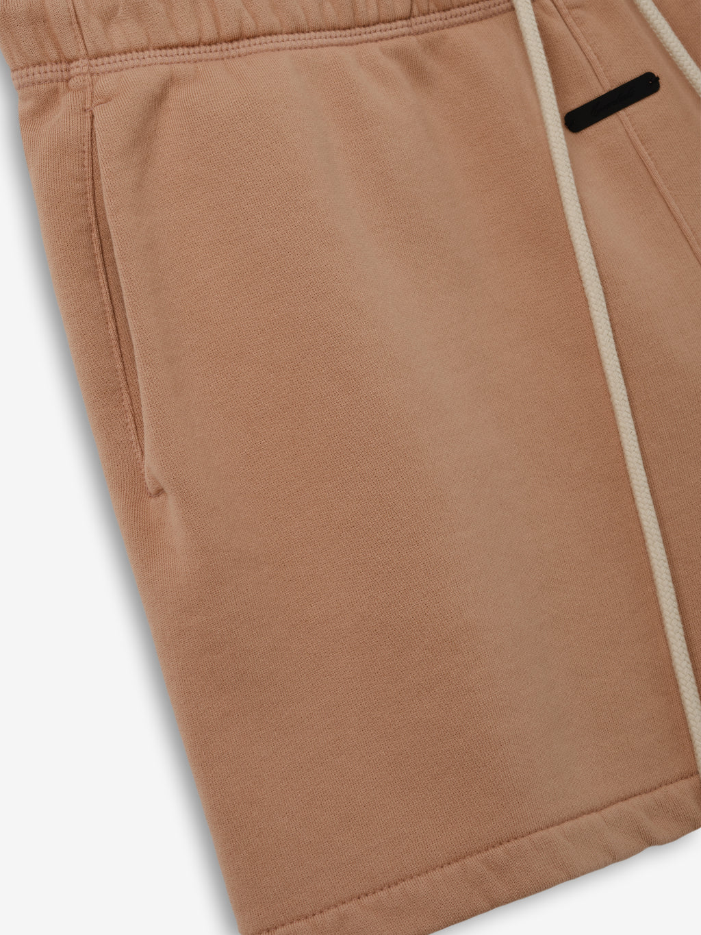 Womens Classic Fit Short in a soft washed ginger color featuring an elastic waistband with drawstrings, side pockets, and a relaxed silhouette for casual comfort.