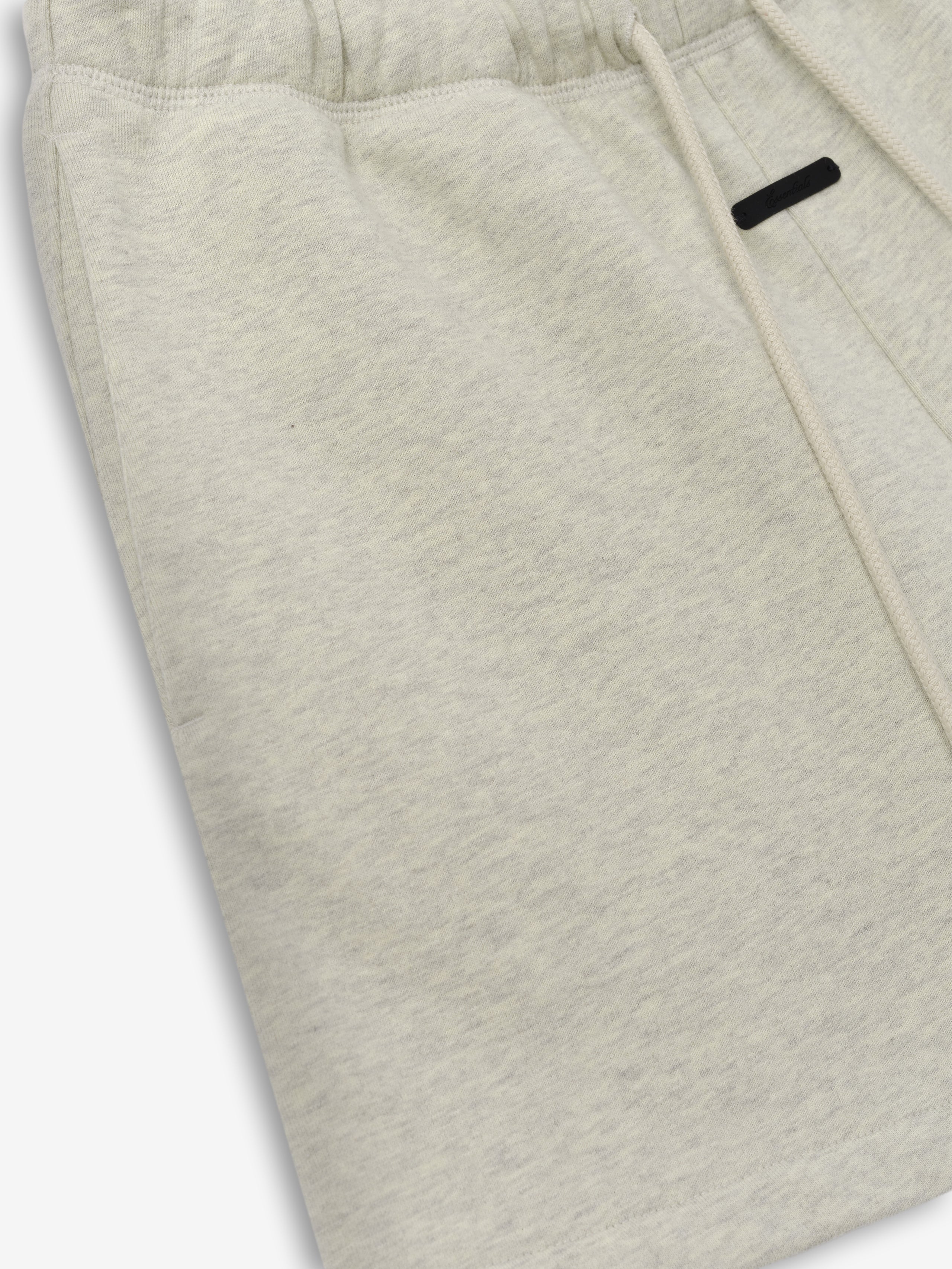 Womens Classic Fit Short in a soft washed vanilla heather shade featuring an adjustable drawstring waistband, subtle side pocket, and a relaxed cut for comfortable casual bottoms.