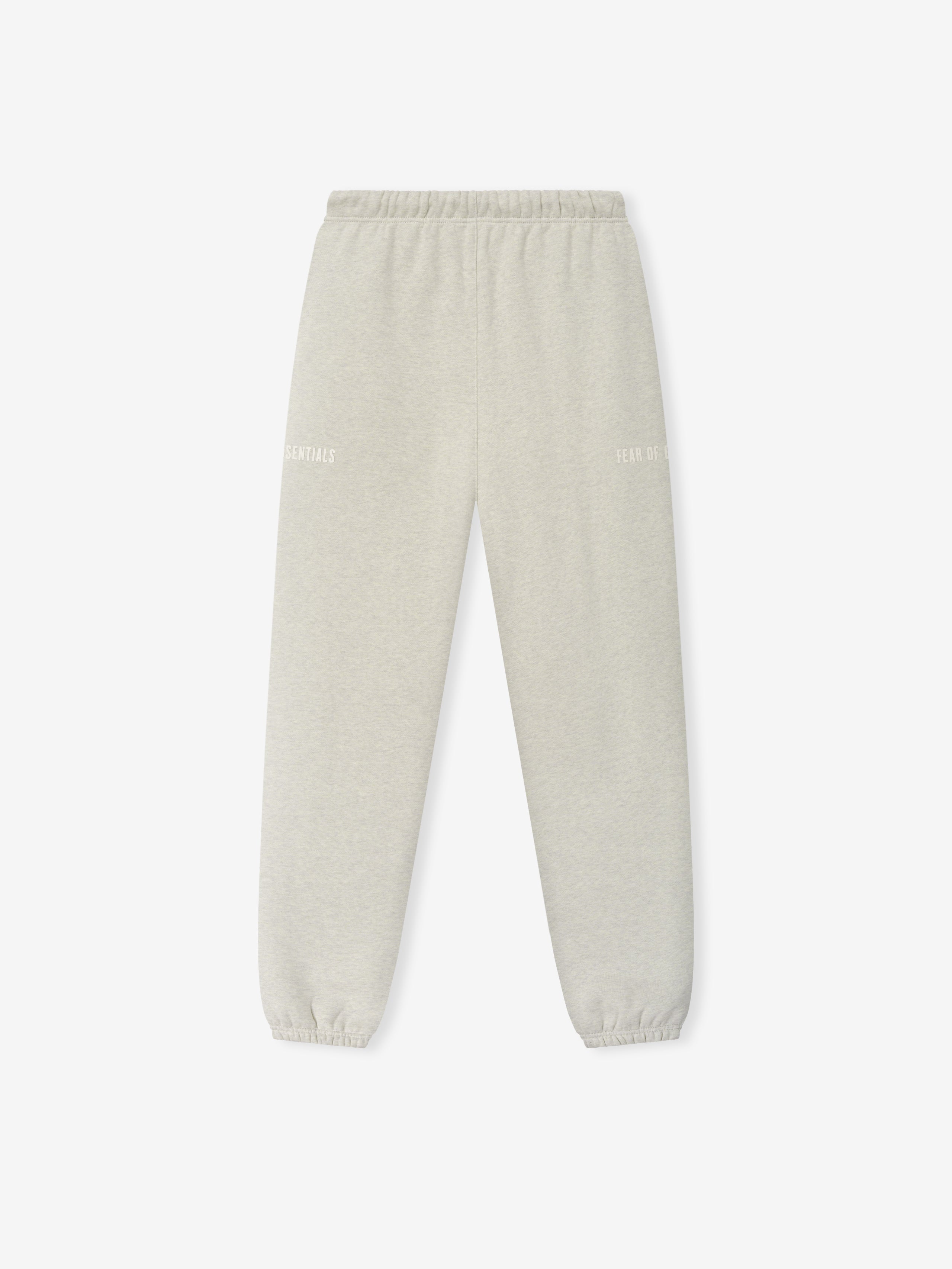 Classic Fleece Sweatpant in a soft vanilla heather shade with an elastic waistband, cuffed ankles, subtle tonal branding on each leg, and a comfortable relaxed fit for casual bottoms.